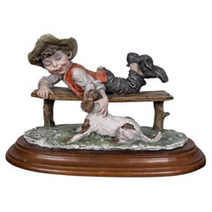 Italian Capodimonte Style Figure Boy with Dog on Bench, Giuseppe Armani