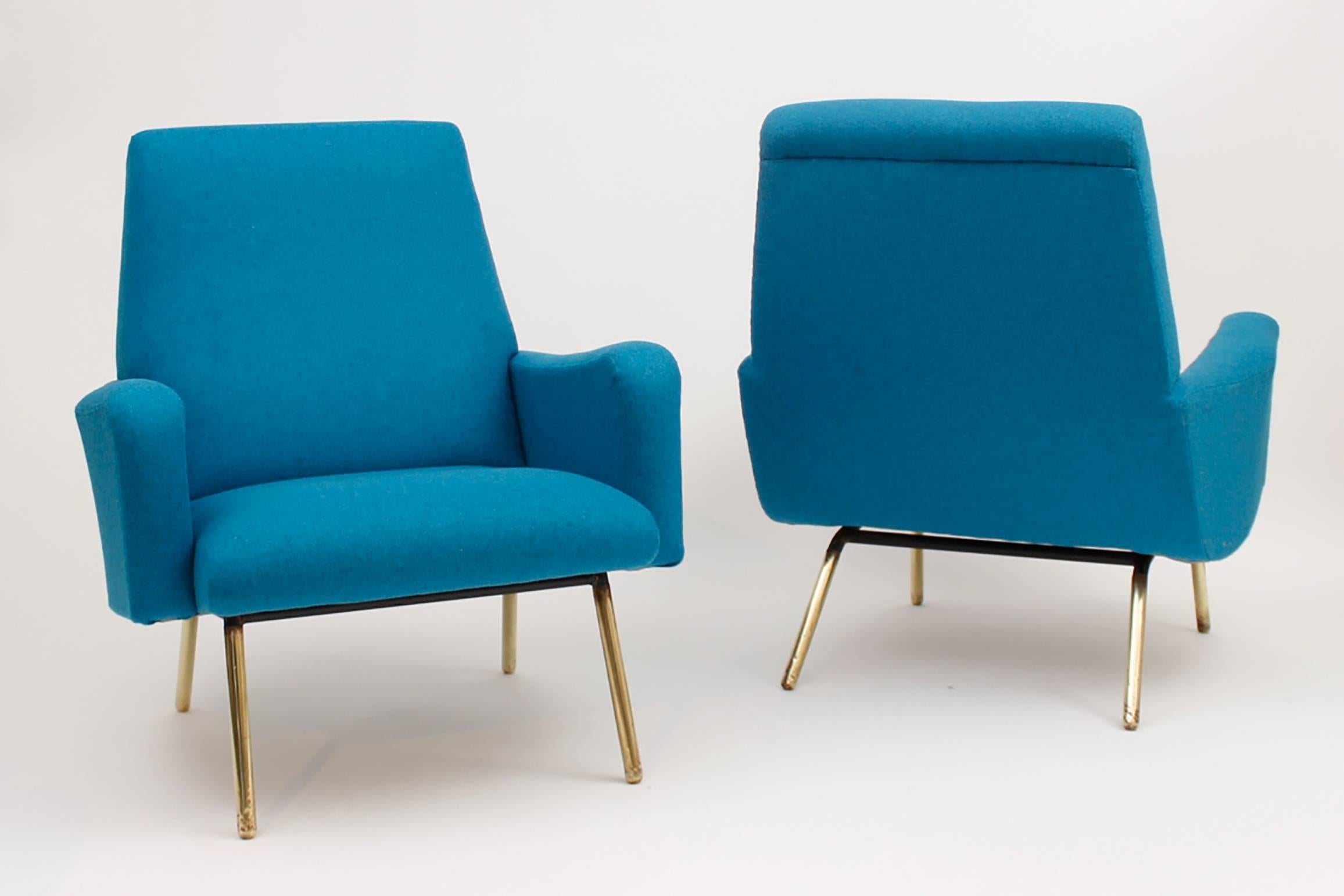 Pair of Gerard Guermonprez armchairs, France, circa 1950.
Newly upholstered in blue Casal fabric, polished brass legs.