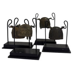 Set of Four 20th Century Burmese Bronze Cowbells on Custom Stands