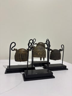 Set of Four 20th Century Burmese Bronze Cowbells on Custom Stands