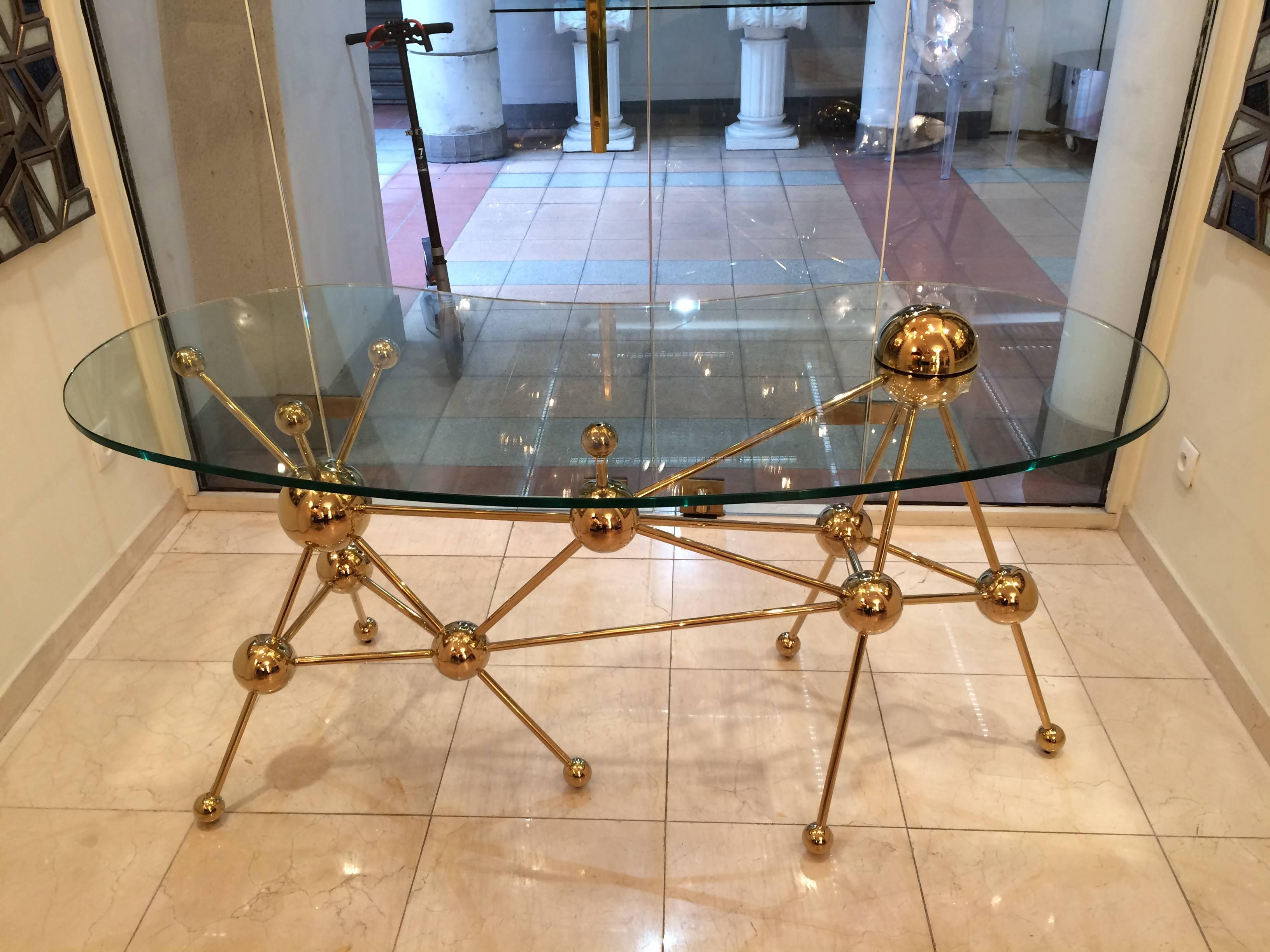 Very decorative desk or console in gilded metal and glass.