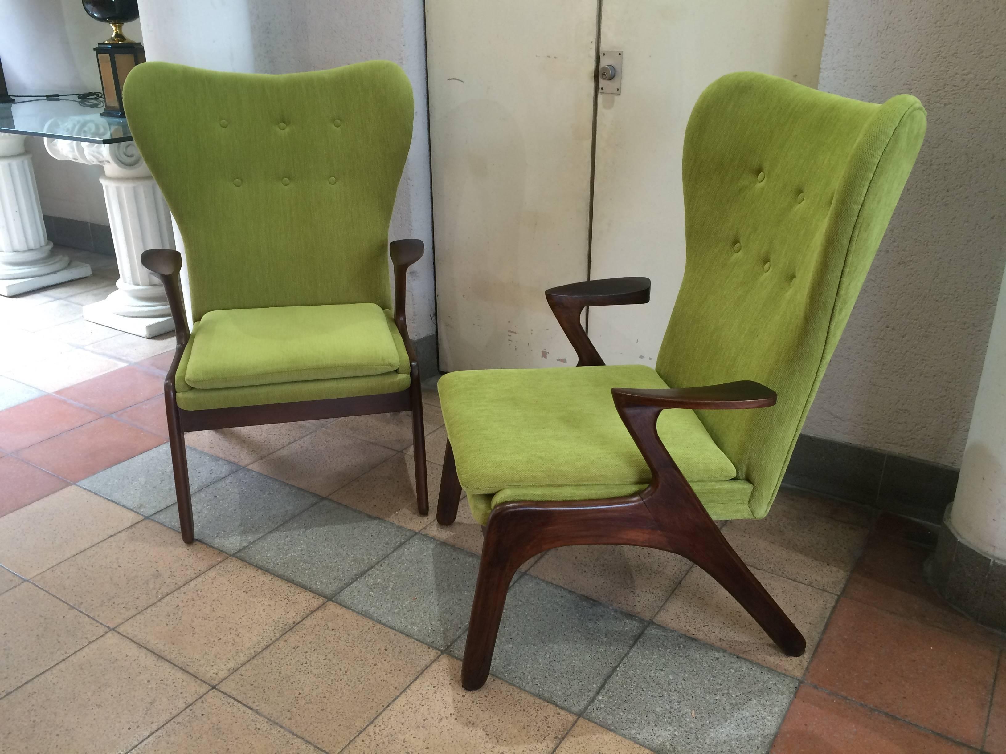 Pair of Danish style armchairs in dark wood and newly covered in light green velvet.