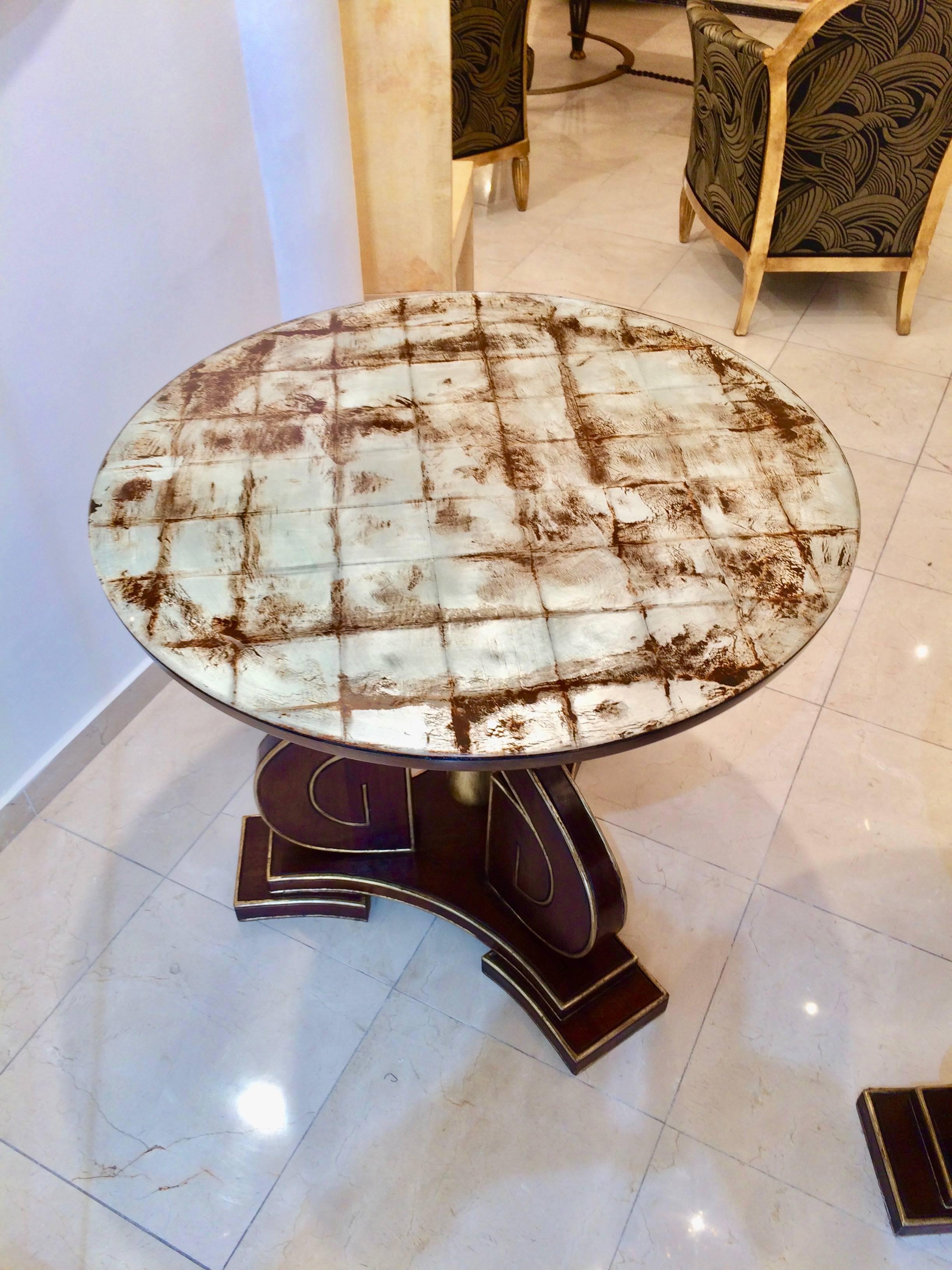 Extraordinary pair of 1940s tables in dark walnut and silver leaf.
The glass top present a silver leaf patina.