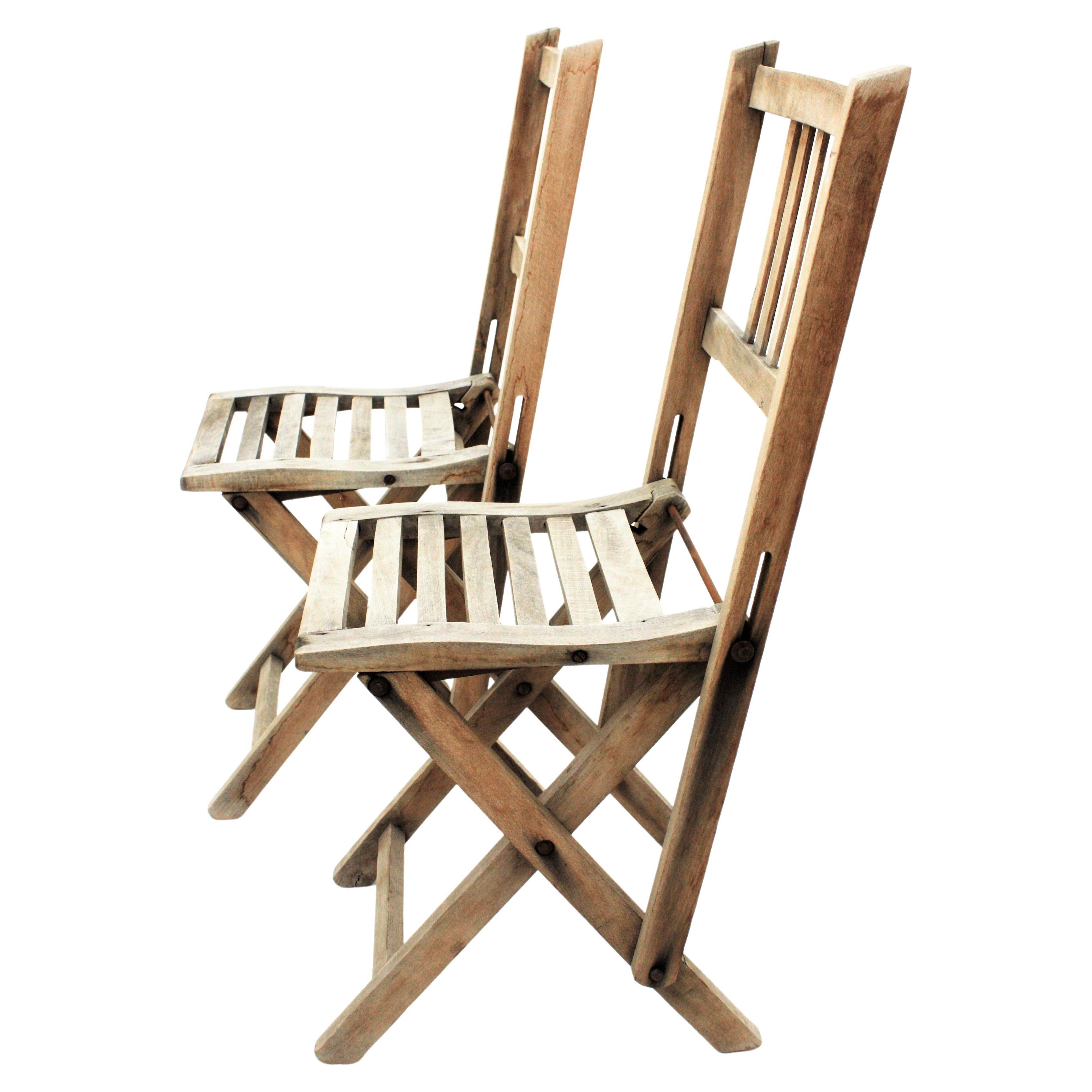 Lovely pair of small sized beech wood terrace or garden folding chairs. Spain, 1940s
This cute pair of handcrafted garden chairs are unusual in this child-size.
They are made of beech wood with natural patina without varnish.
A good addition to be