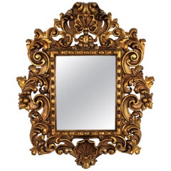 Miroir espagnol en bois doré avec cadre et crête de feuillage