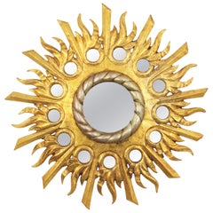 Gilt Silvered Sunburst Mirror in Carved Wood with Round Mirror Inlays
