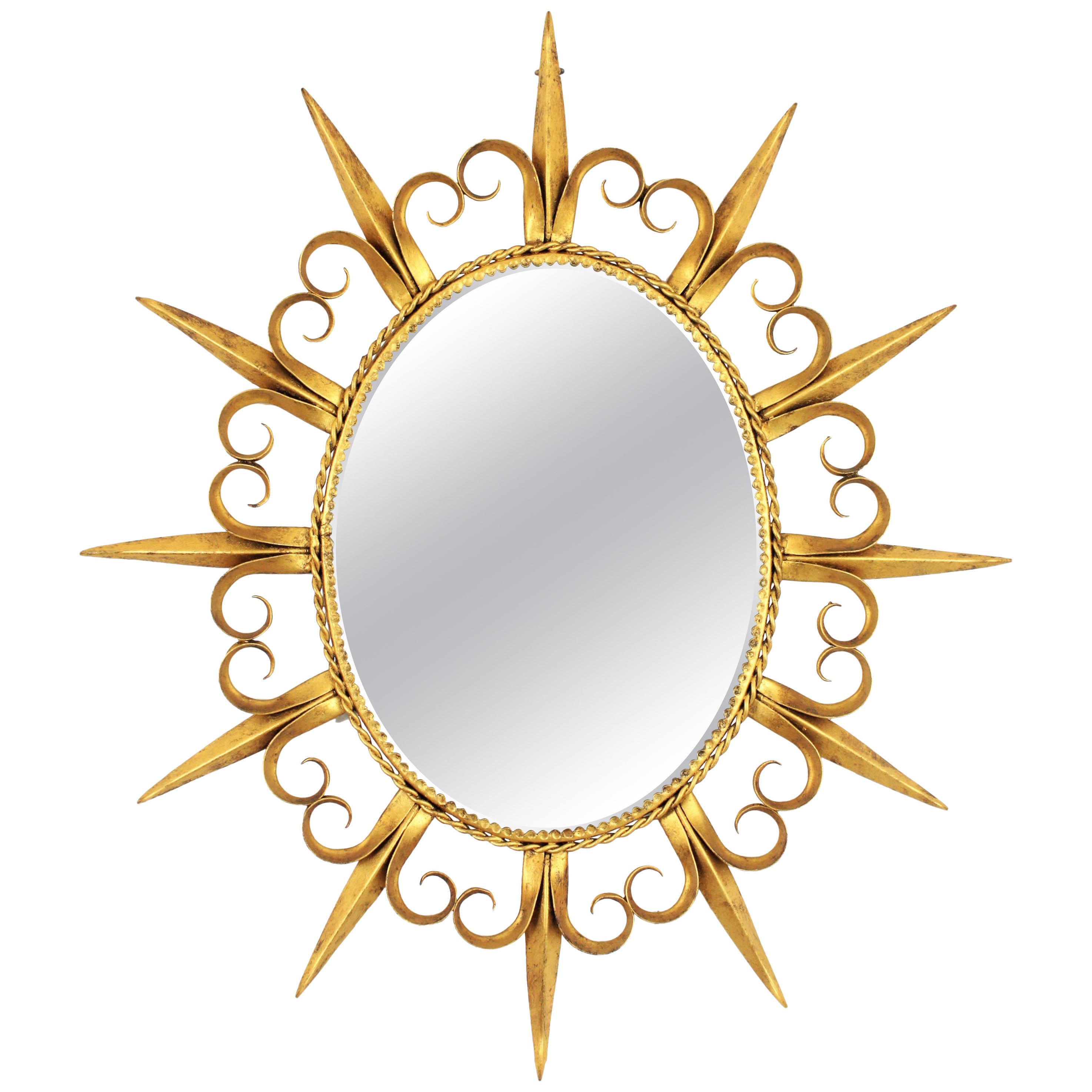 Miroir ovale Sunburst en fer forgé doré à œillets