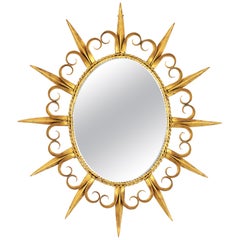 Sunburst Eyelash Oval Mirror in Gilt Wrought Iron