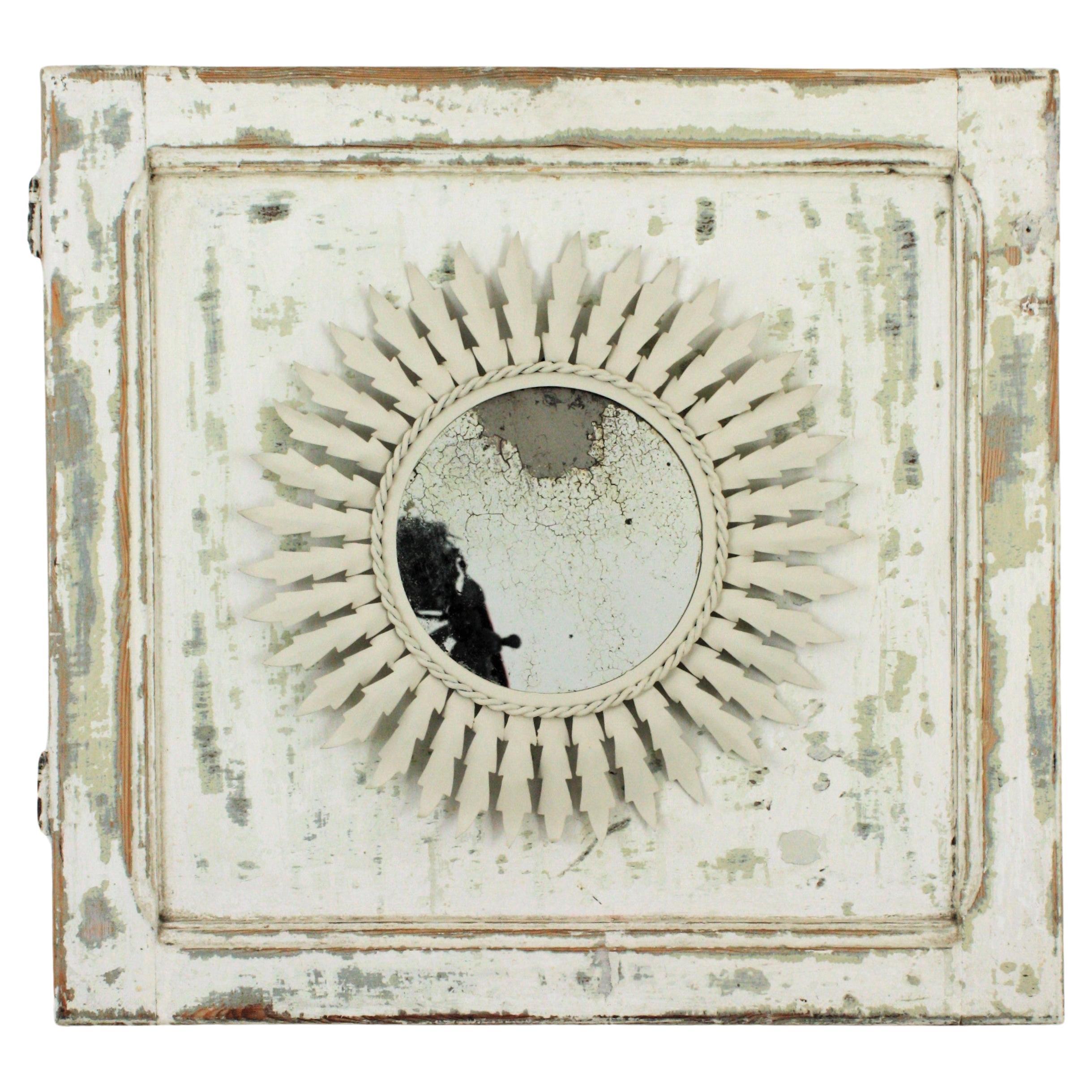 Spanish Sunburst Mirror in White Metal Framed by a Wood Patinated Door For Sale