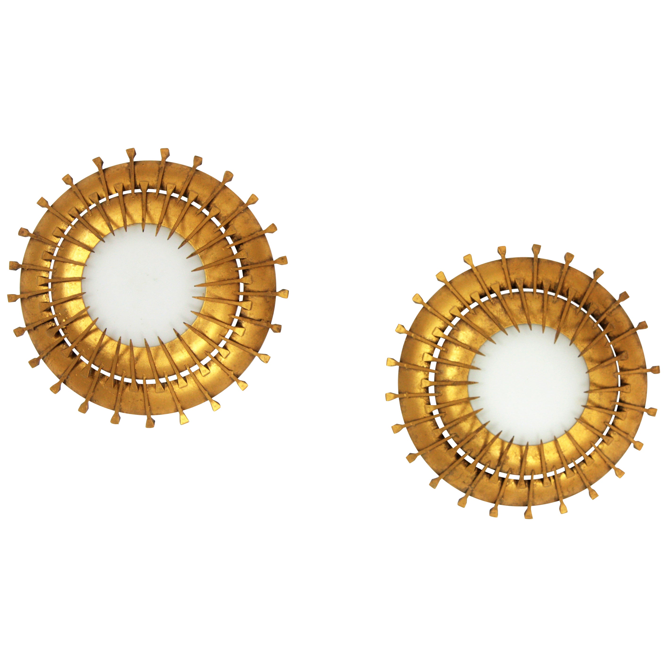 French 1940s-1950s sunburst light fixtures, milk glass, gilt iron
Beautiful pieces placed alone but also interesting mixed with other light fixtures in this manner to create a ceiling constellation or a wall composition. These light fixtures could