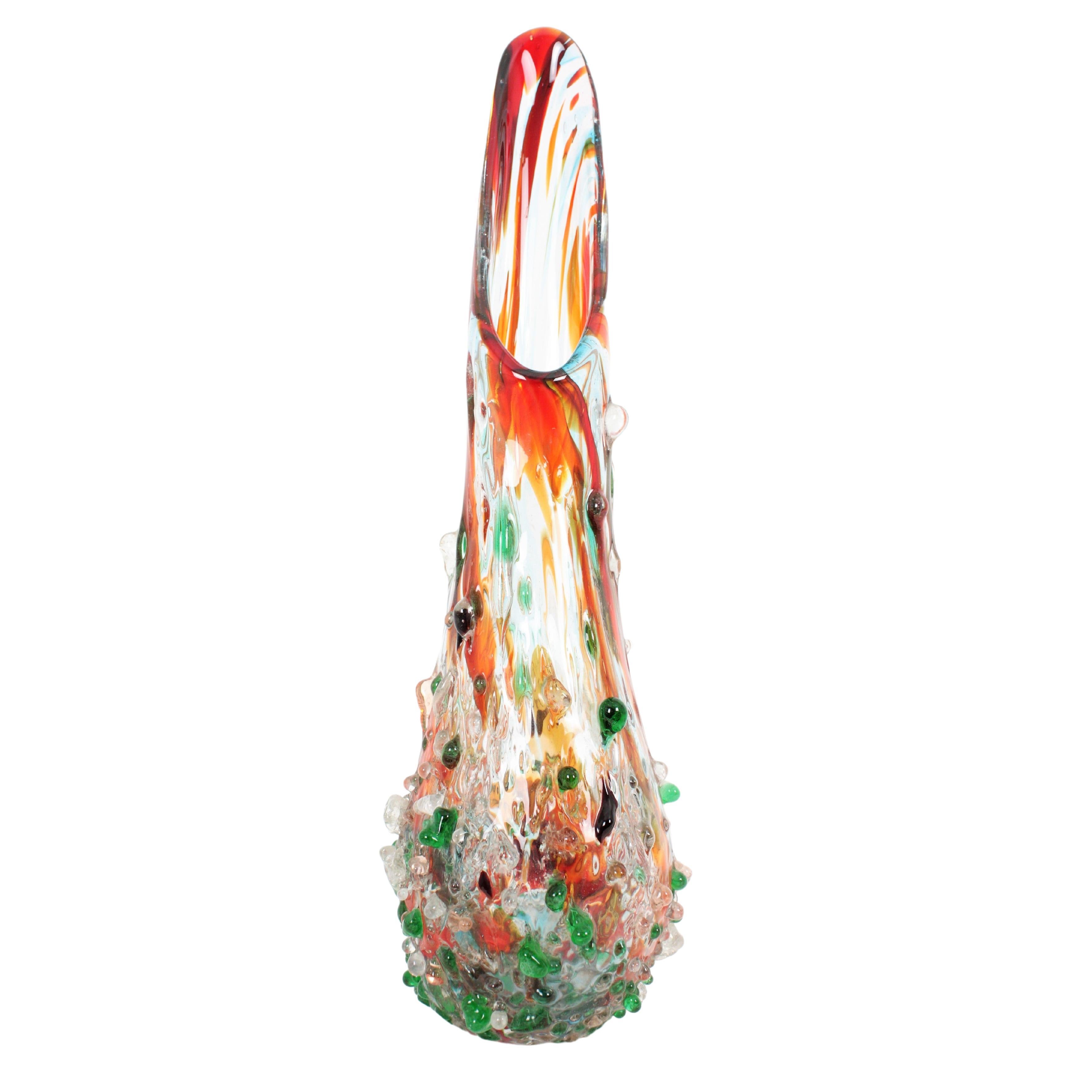 Sculptural hand-blown Italian art Murano multicolor glass vase with applied colorful big glass drops in the style of Cenedese. Italy, 1970s.
Large size
This exquisite large vase, with murrine inclusions and applied glass drops in red, orange, green,