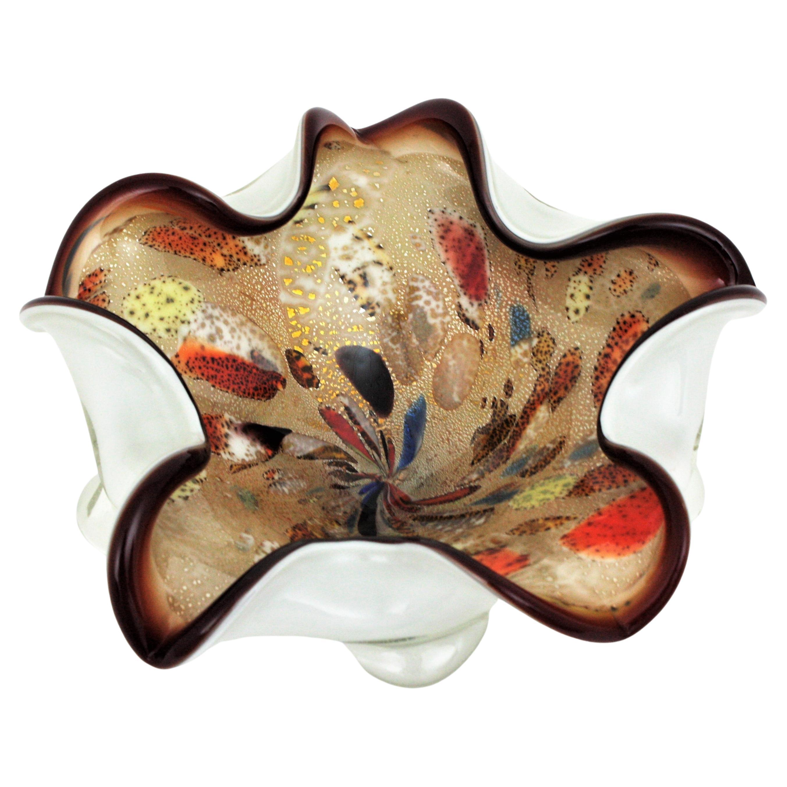 Colorful handblown Murano glass flower bowl with siver and gold flecks by Dino Martens. Italy, 1960s
This eye-catching large bowl is full of details. The interior part in shades of brown is accented by multicolor murrine details and aventurine