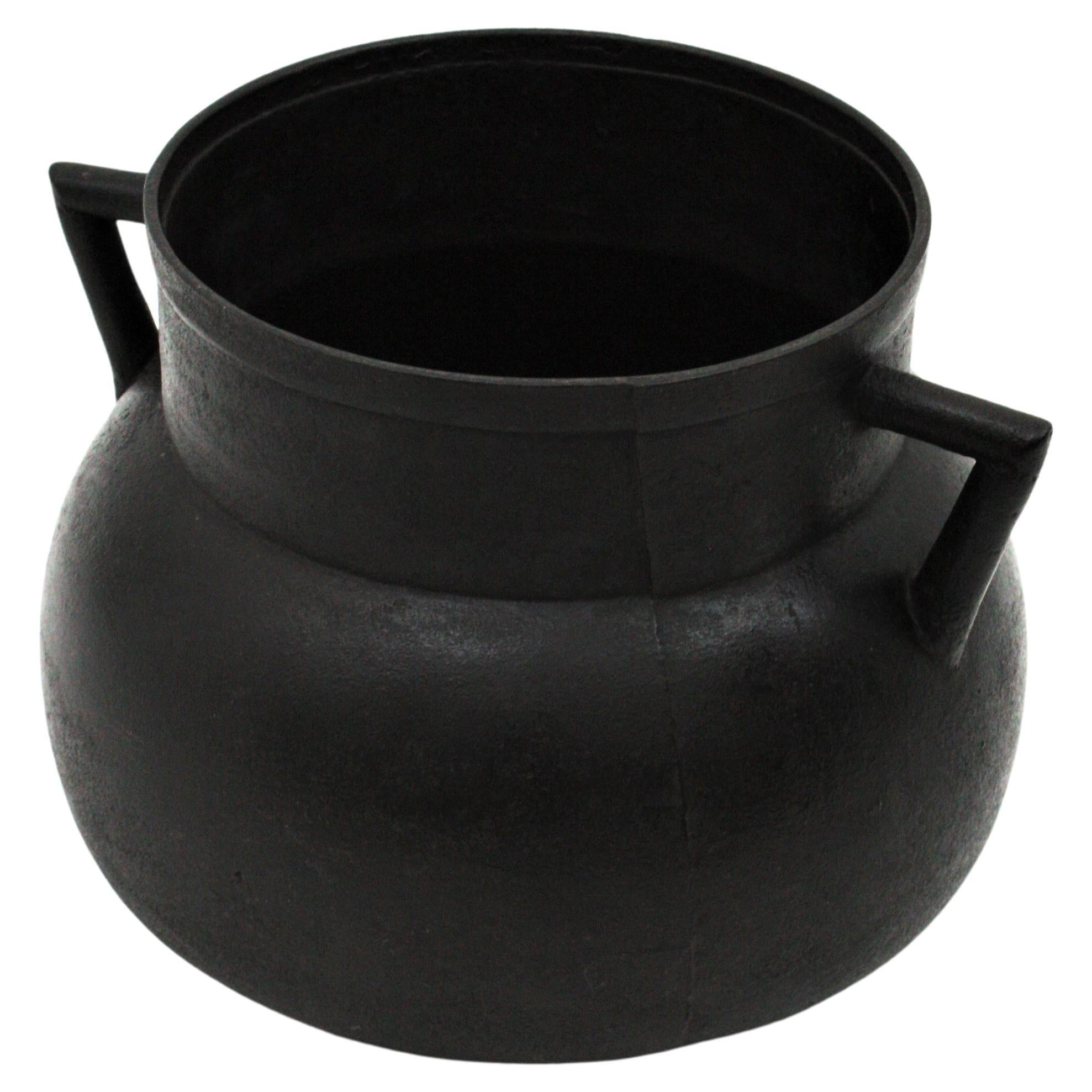 Cast iron kitchen cauldron with handles from Galicia, Spain, 1920s
Made in molded/cast iron, originally used for cooking. This cast iron vessel is heavily constructed, it is strong and sturdy and ready to be used. It has a nice aged