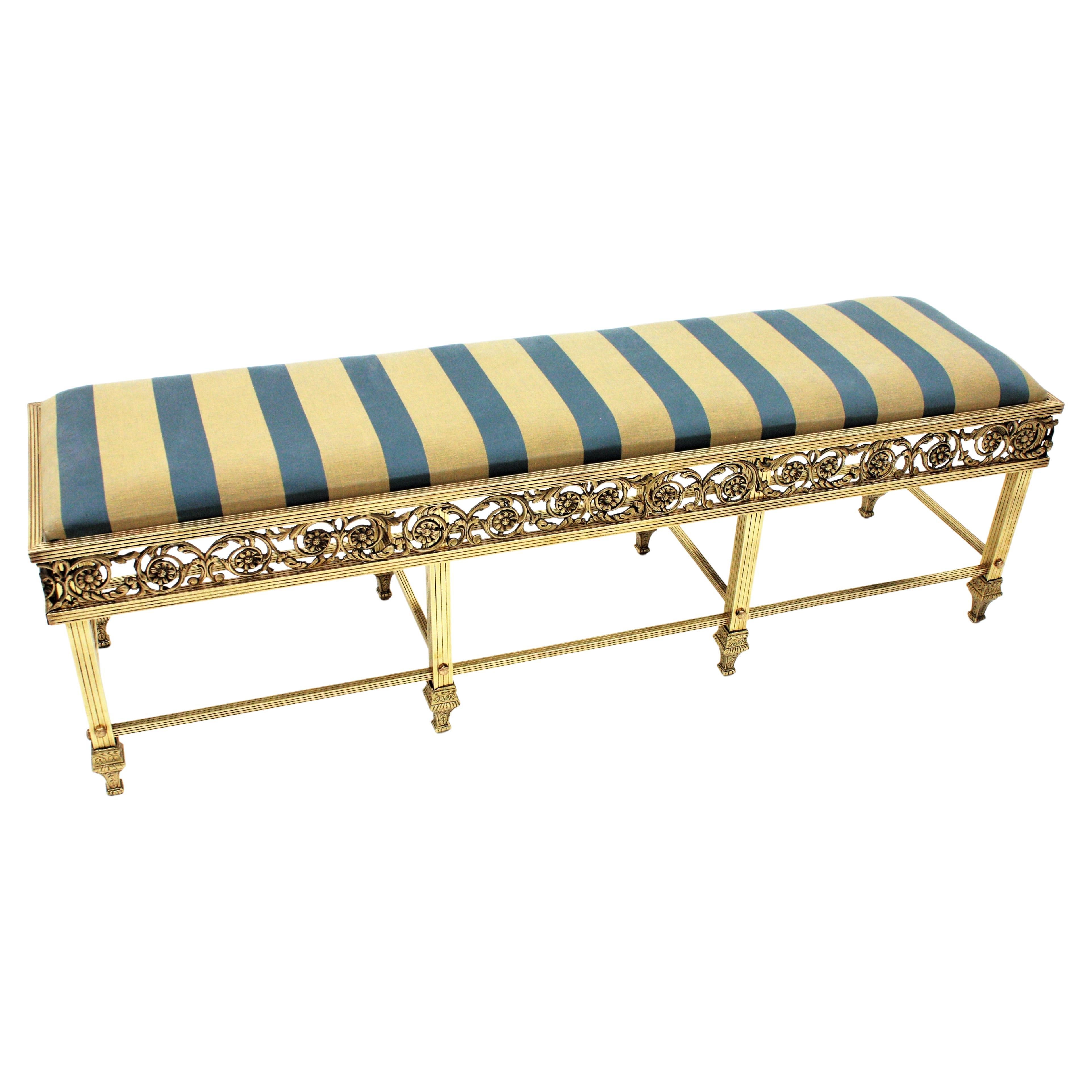 Elegant hall or bedroom brass long bench upholstered in striped silk fabric, France, 1930s
This outstanding neoclassical style bench was manufactured at the Art Deco Period.
The seat stands on eight legs joined between them with stretchers. The