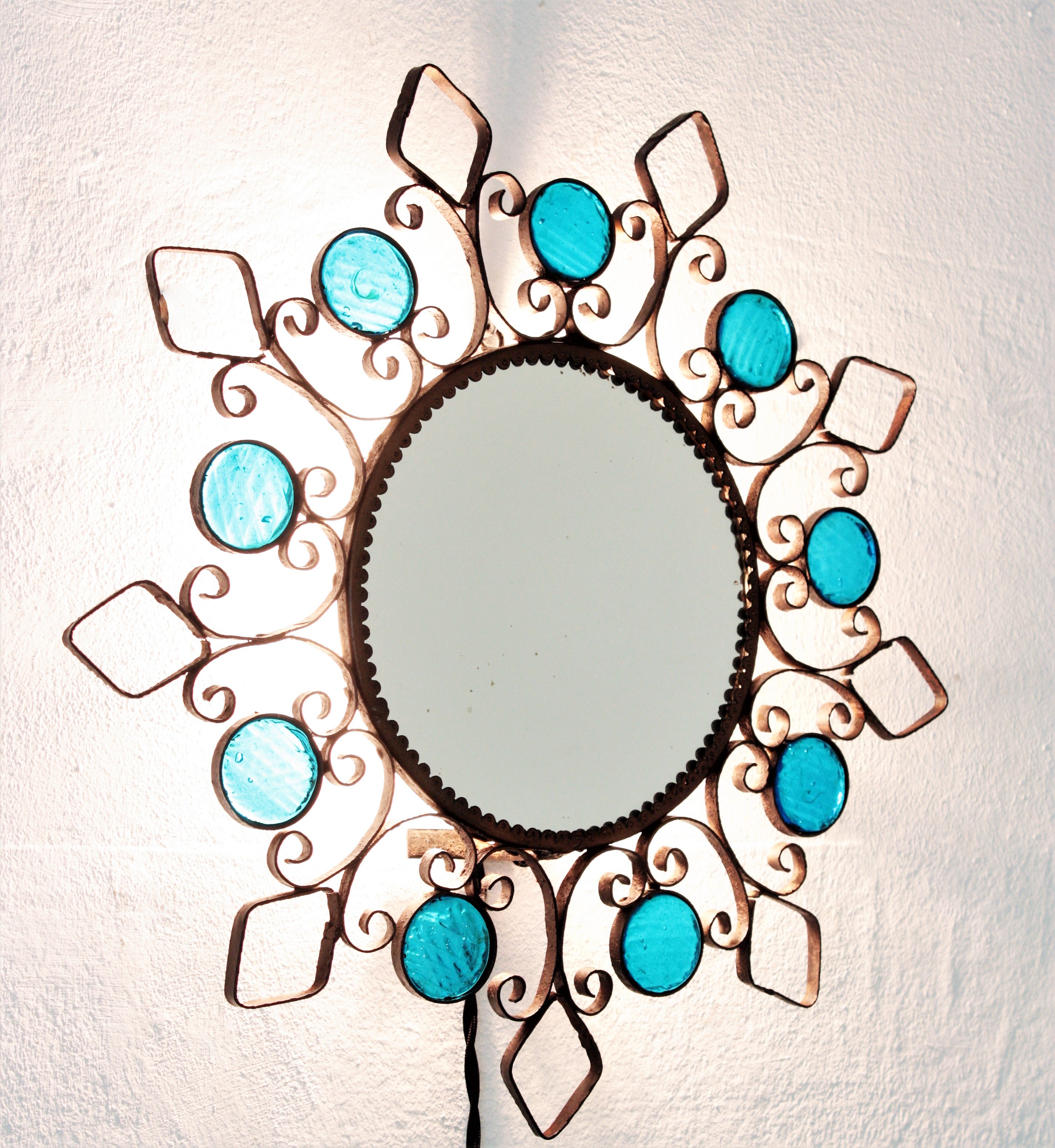 Backlit Iron Sunburst Mirror / Wall Light Fixture with Blue Glass Details, 1950s For Sale