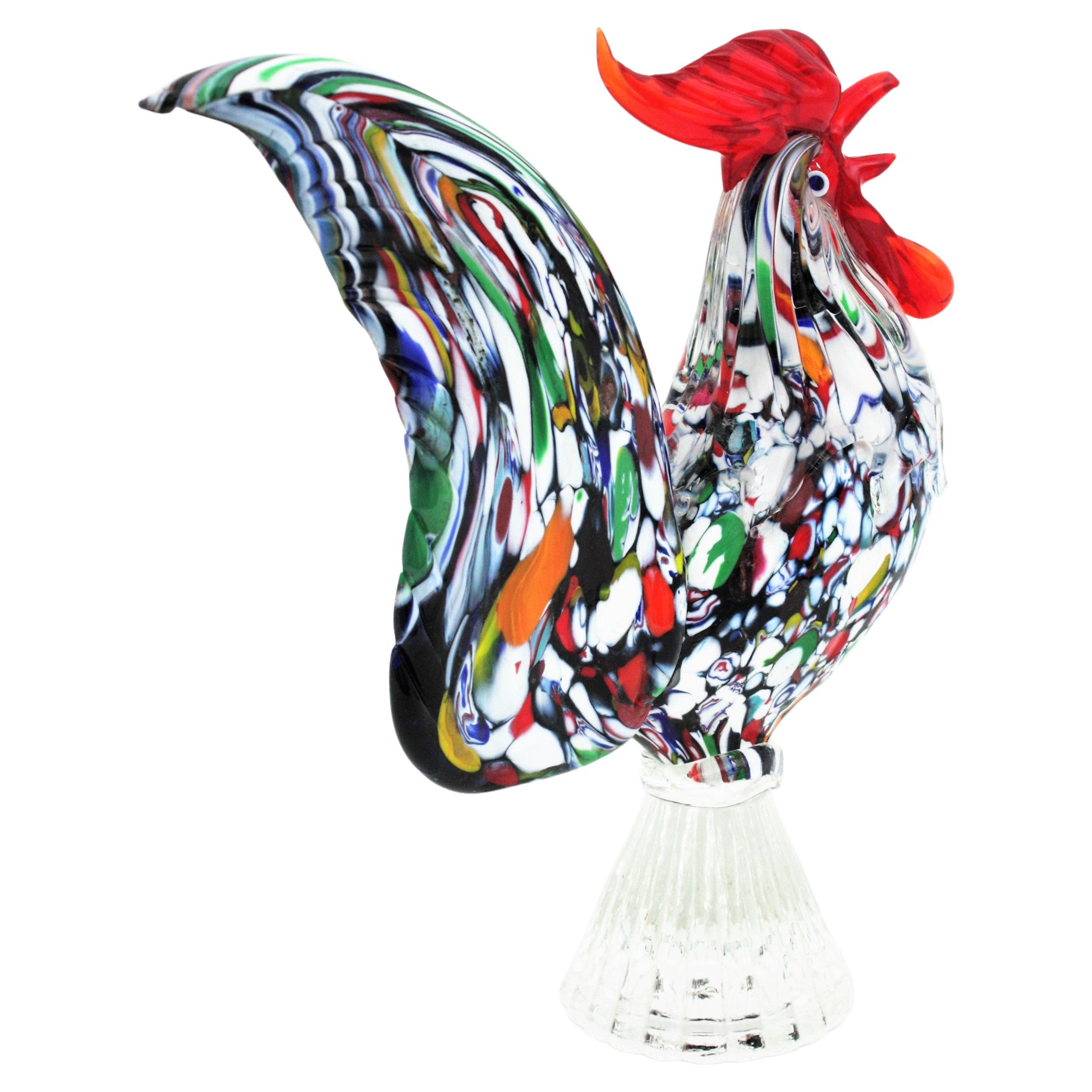 Colorful Mid-Century Modern Murano Millefiori Murrine Art glass rooster figurine. Attributed to Fratelli Toso, Italy, 1960s.
This eye-catching cock rooster blown glass sculpture or paperweight features an exquisite Master work with hundreds of