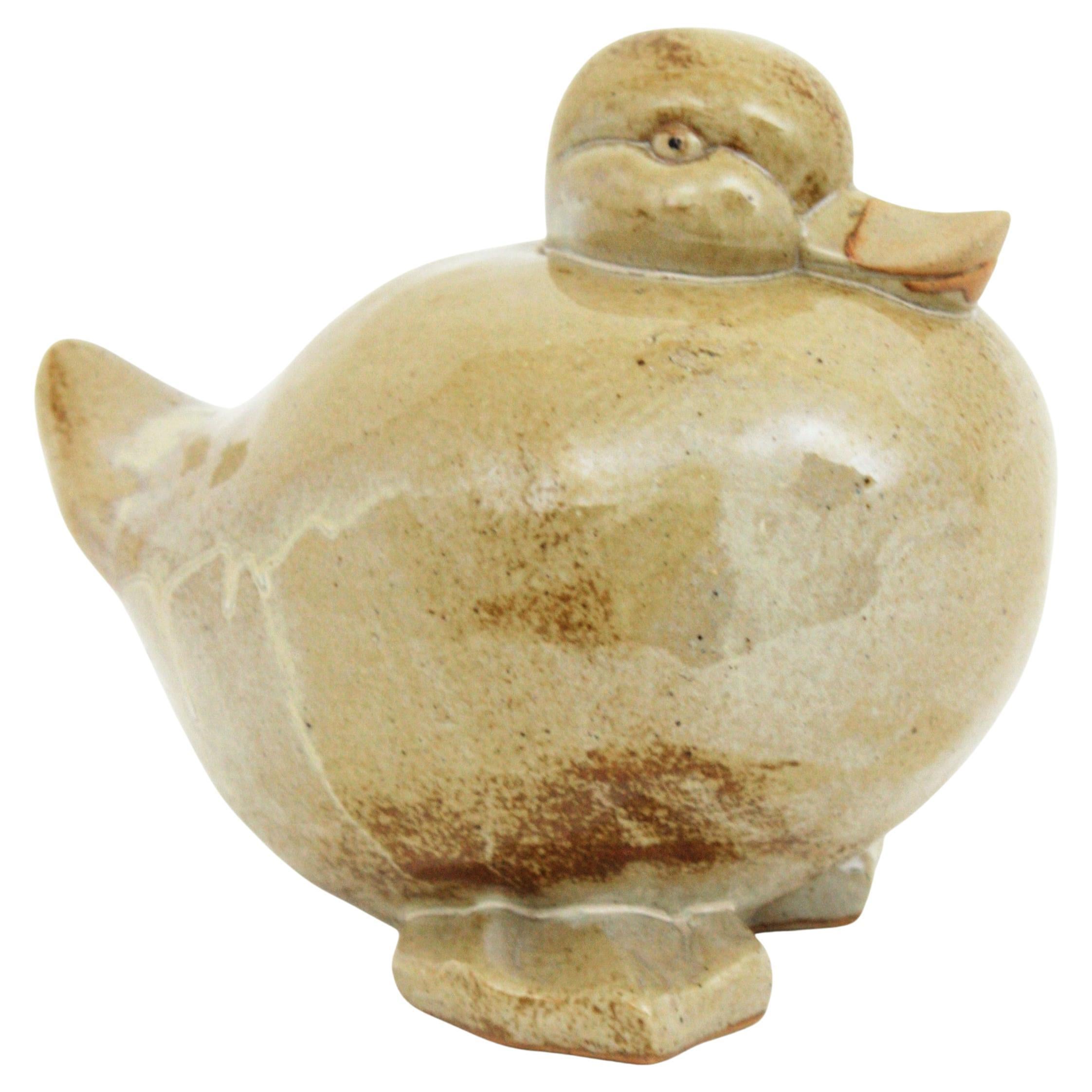 Scultura centrotavola di anatra in terracotta smaltata beige