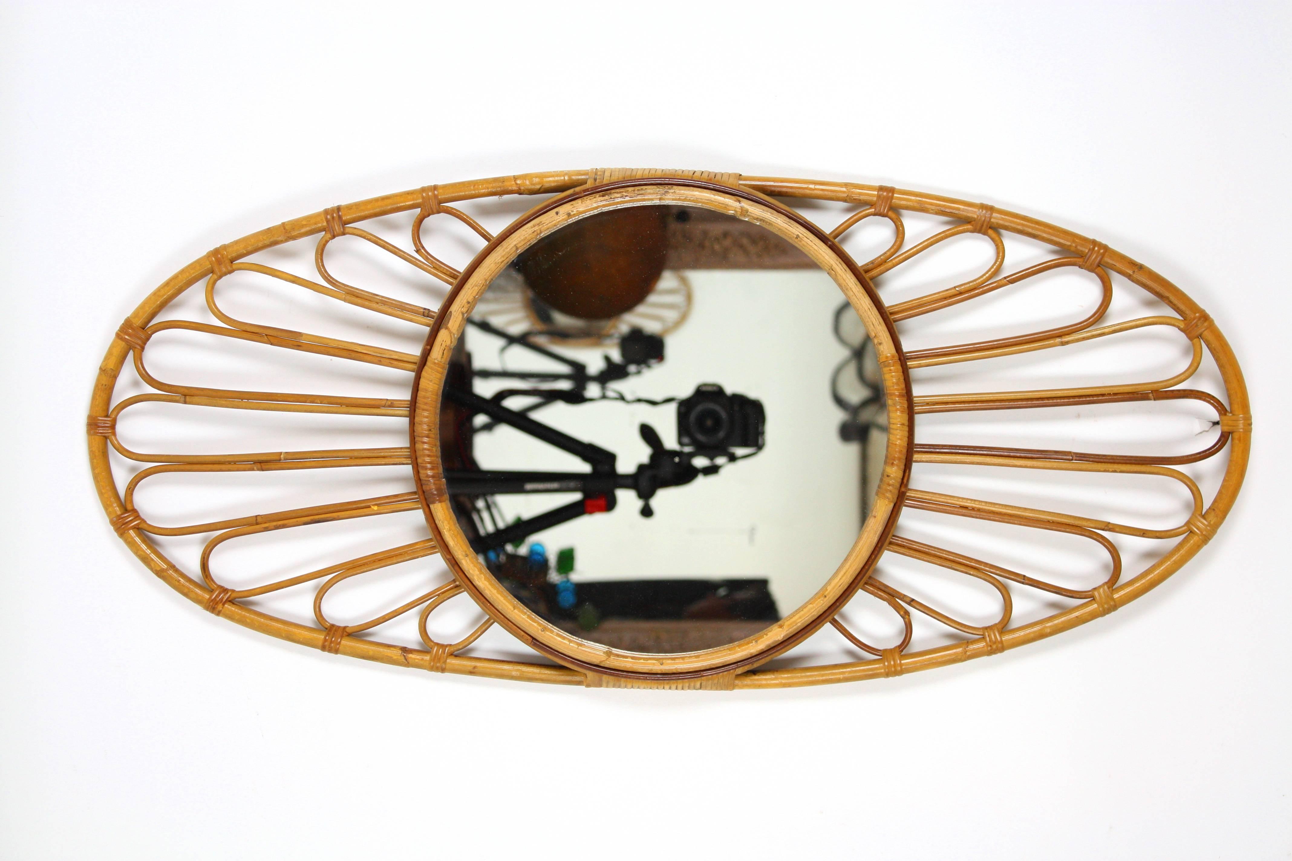 Mid- Century modern bamboo oval mirror with highly decorative frame.
Tis piece is in excellent vintage condition.
Spain c.1960.

Avaliable more bamboo mirrors and other kind of mirrors:
please, kindly check our storefront.