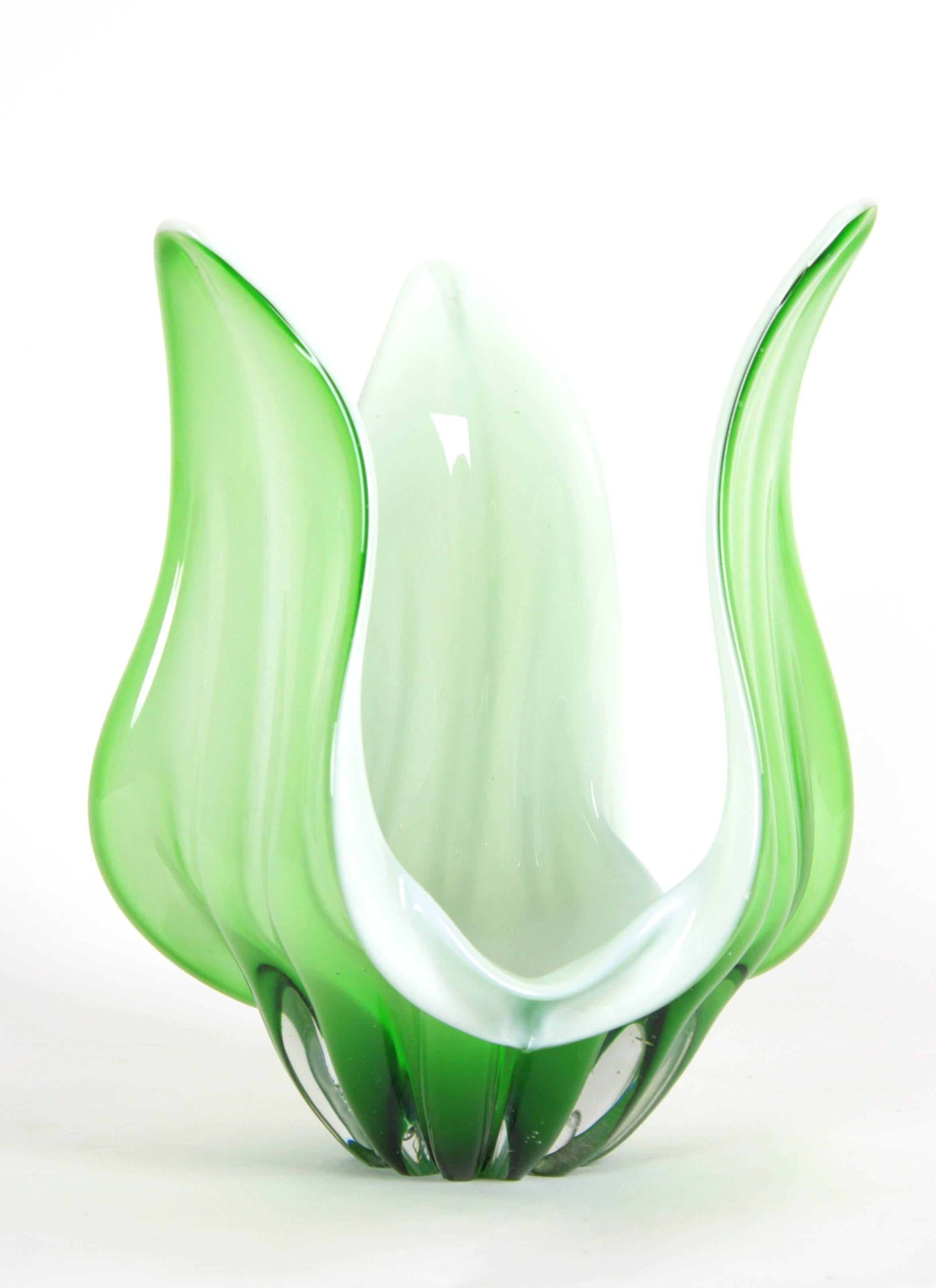 Gorgeous Murano art glass vase or centerpiece with organic shapes in pastel green clear glass and white opaline glass,
handblown glass, Italy, circa 1960.

The vase has a chip under one of its leaves, but only seen if you turn it. Not seen at