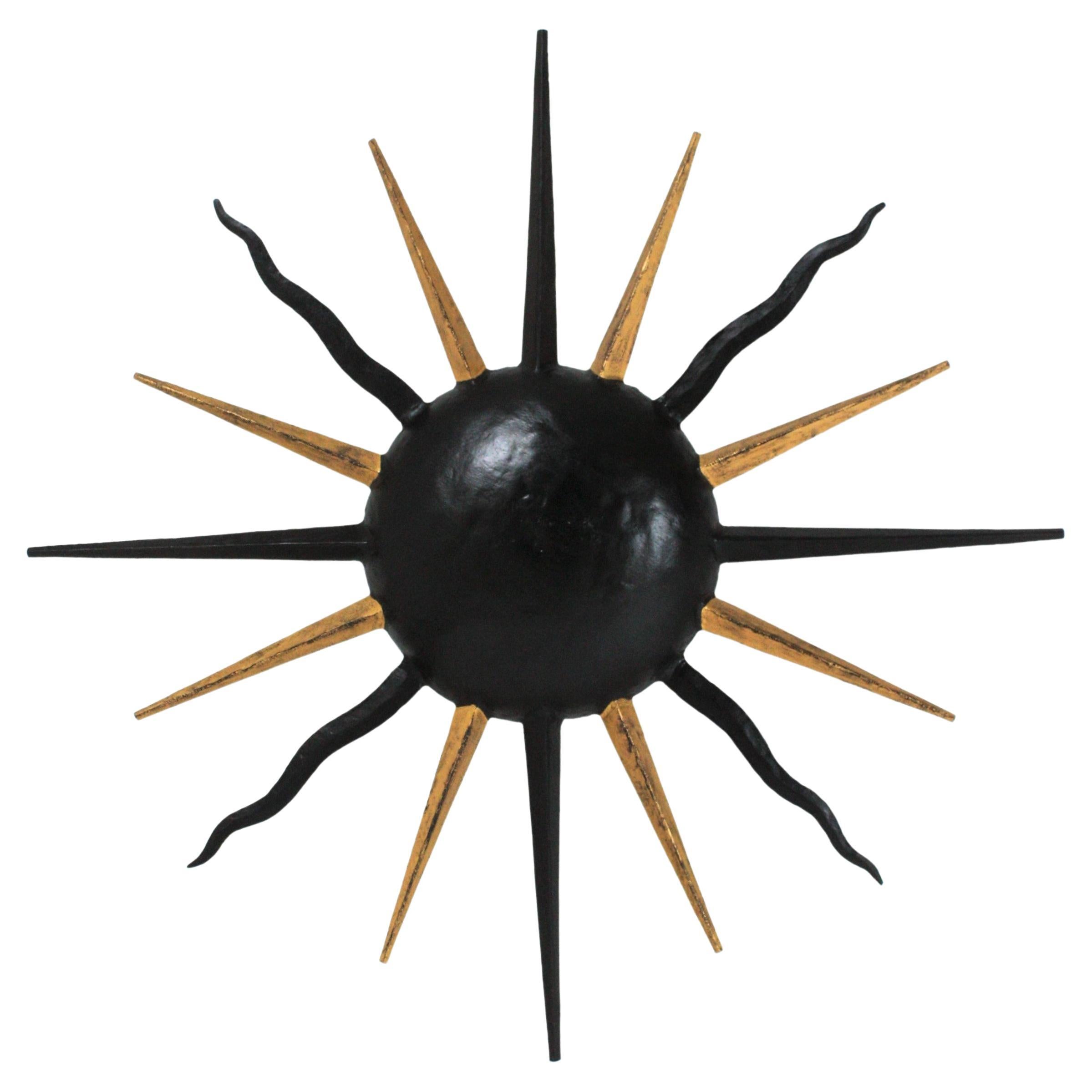French Sunburst Light Fixture in Black and Gilt Iron, Gilbert Poillerat Style For Sale