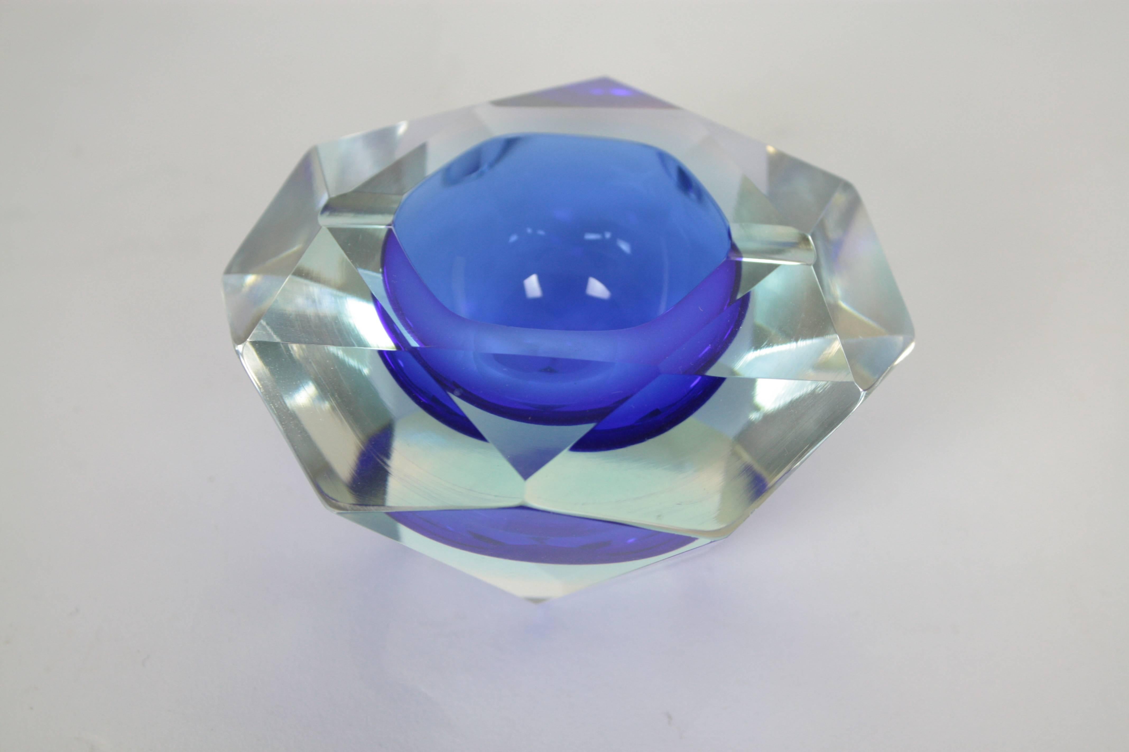  Flavio Poli faceted diamond shaped ashtray in blue color. Blue glass cased into clear glass.
Italy, 1950s.