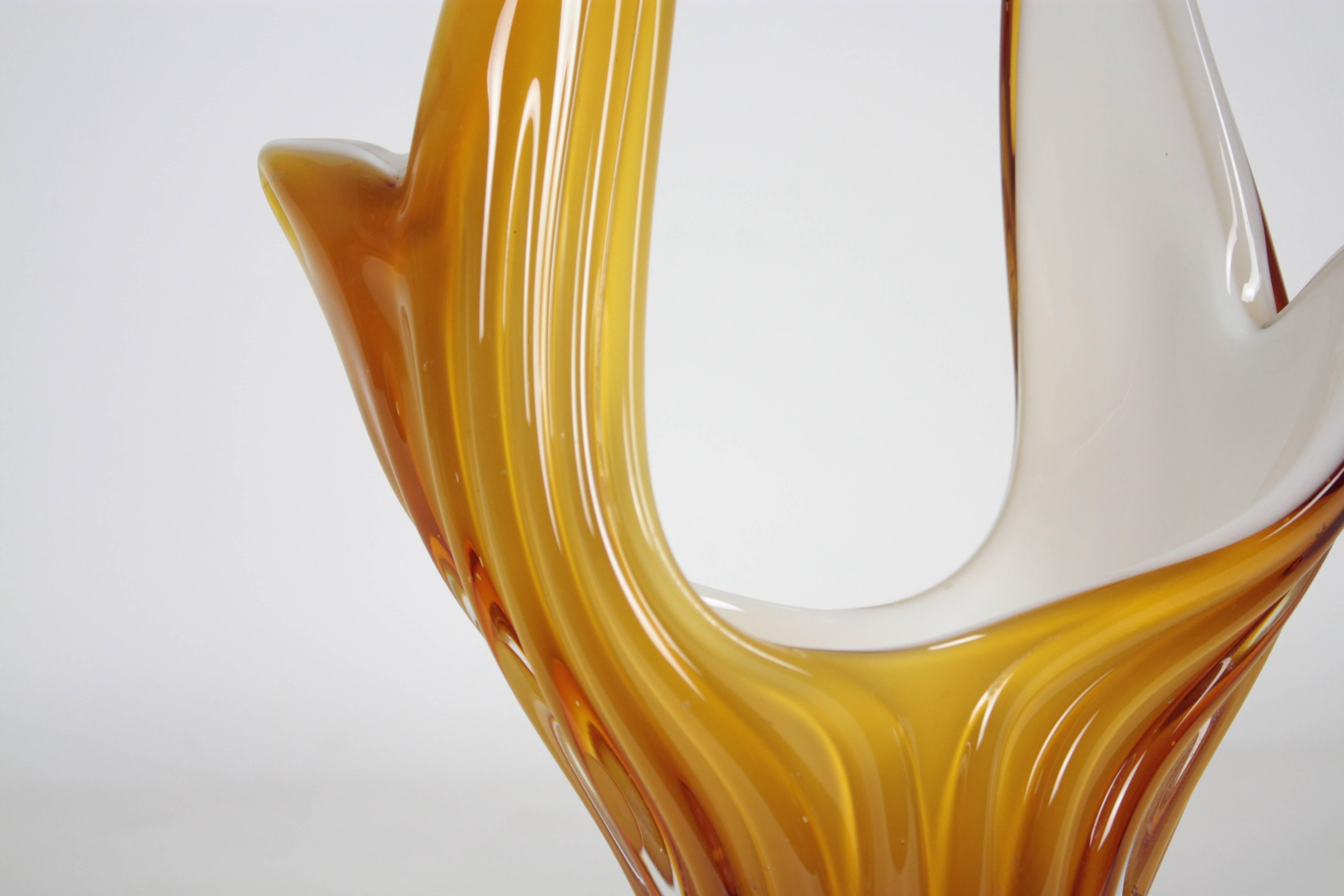 Sculptural Murano glass vase or centerpiece in a delicate toffee color. The interior part is made in opaline glass. Beautiful shapes and very decorative,
Murano, circa 1960.

Available more Murano glass pieces.
Please, kindly check our
