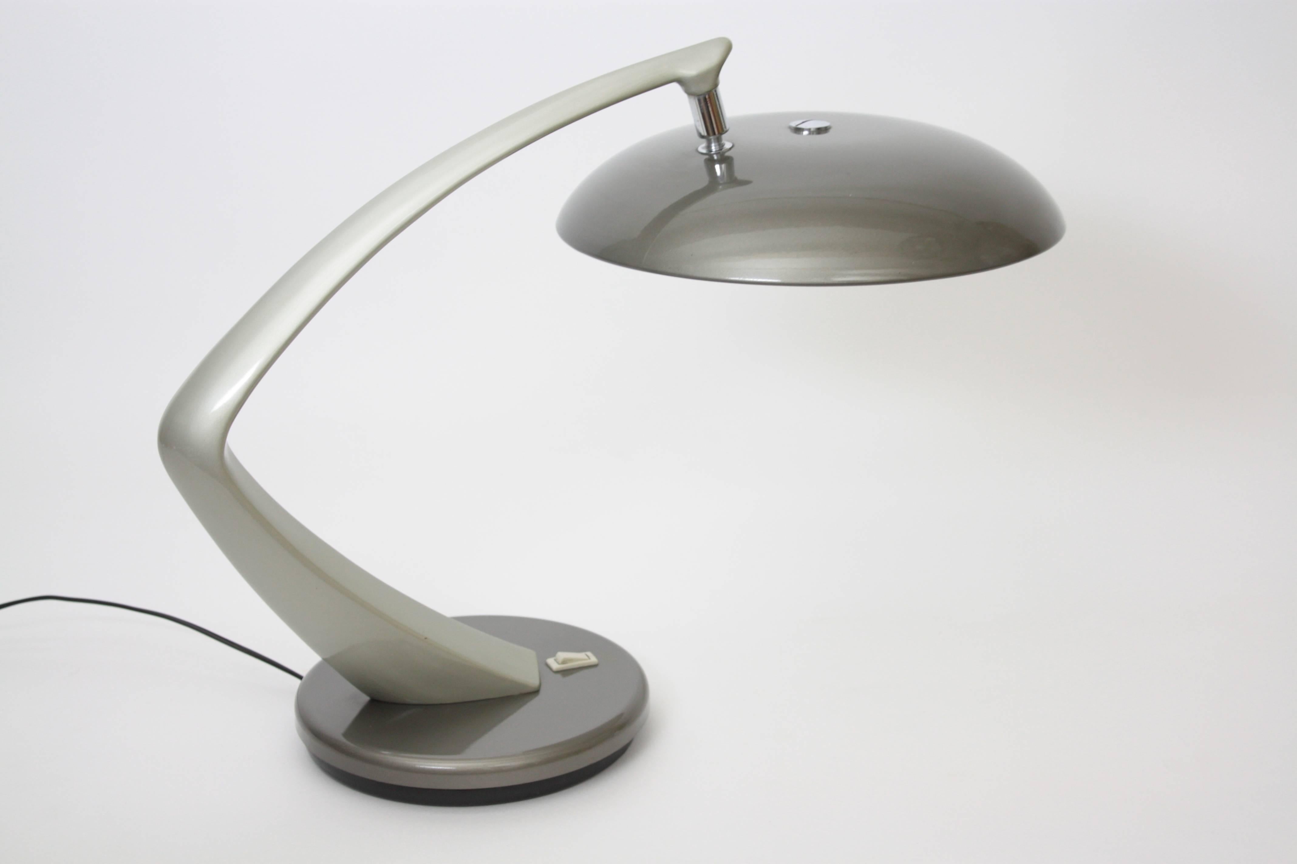 Desk lamp designed and manufactured by Fase, Madrid, 1960s.

Made in dark grey and clear grey enameled steel. Original trade mark engraved at the base.
It has swivel base, adjustable lamp shade and 2 bulbs.
The lamp is excellent condition. It wears