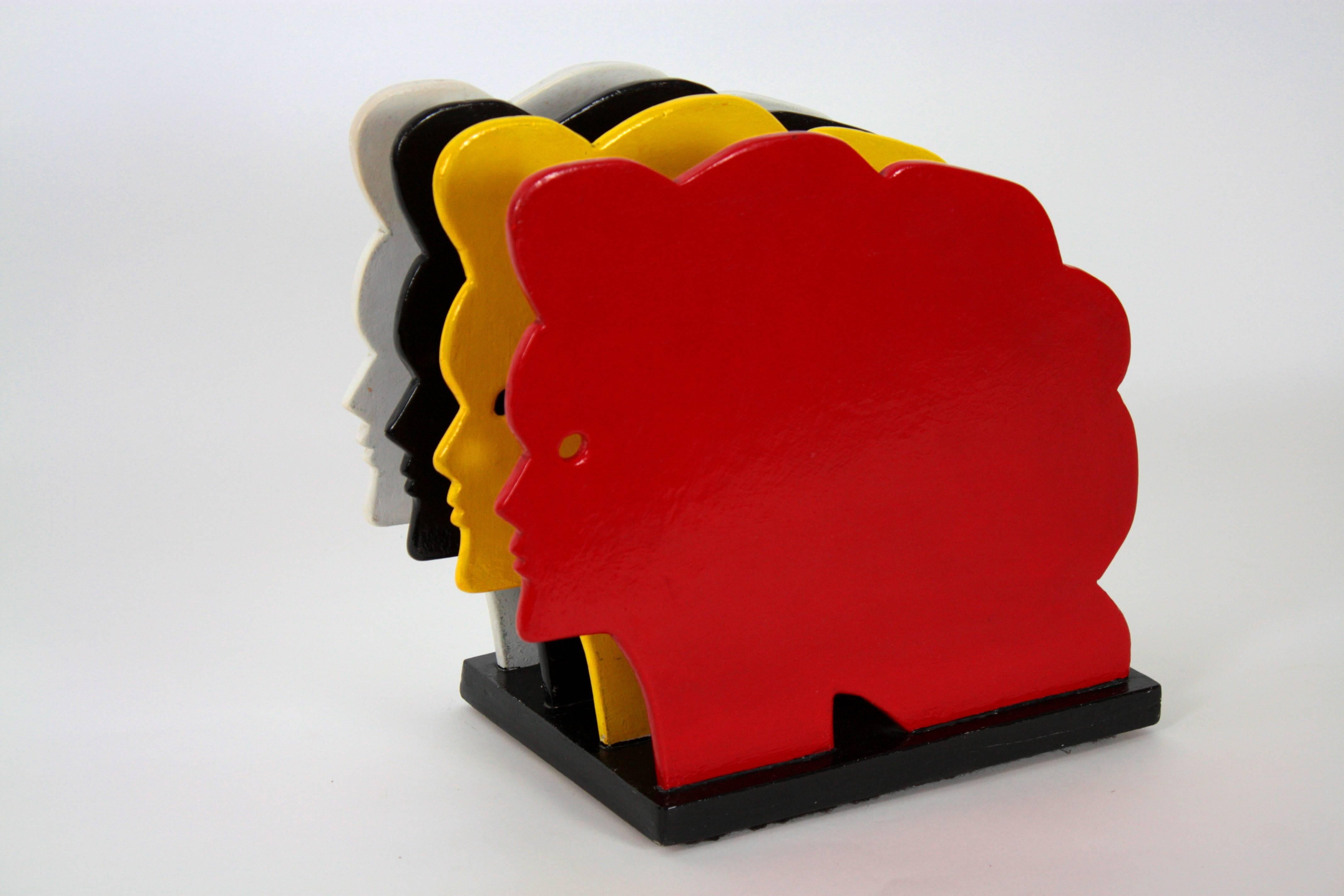 A beautiful and funny magazine rack from a beauty parlour from Barcelona. Made in wood painted in four colors, red, black, yellow and white. 
It has the shape of a woman's head,
Spain, 1970s.