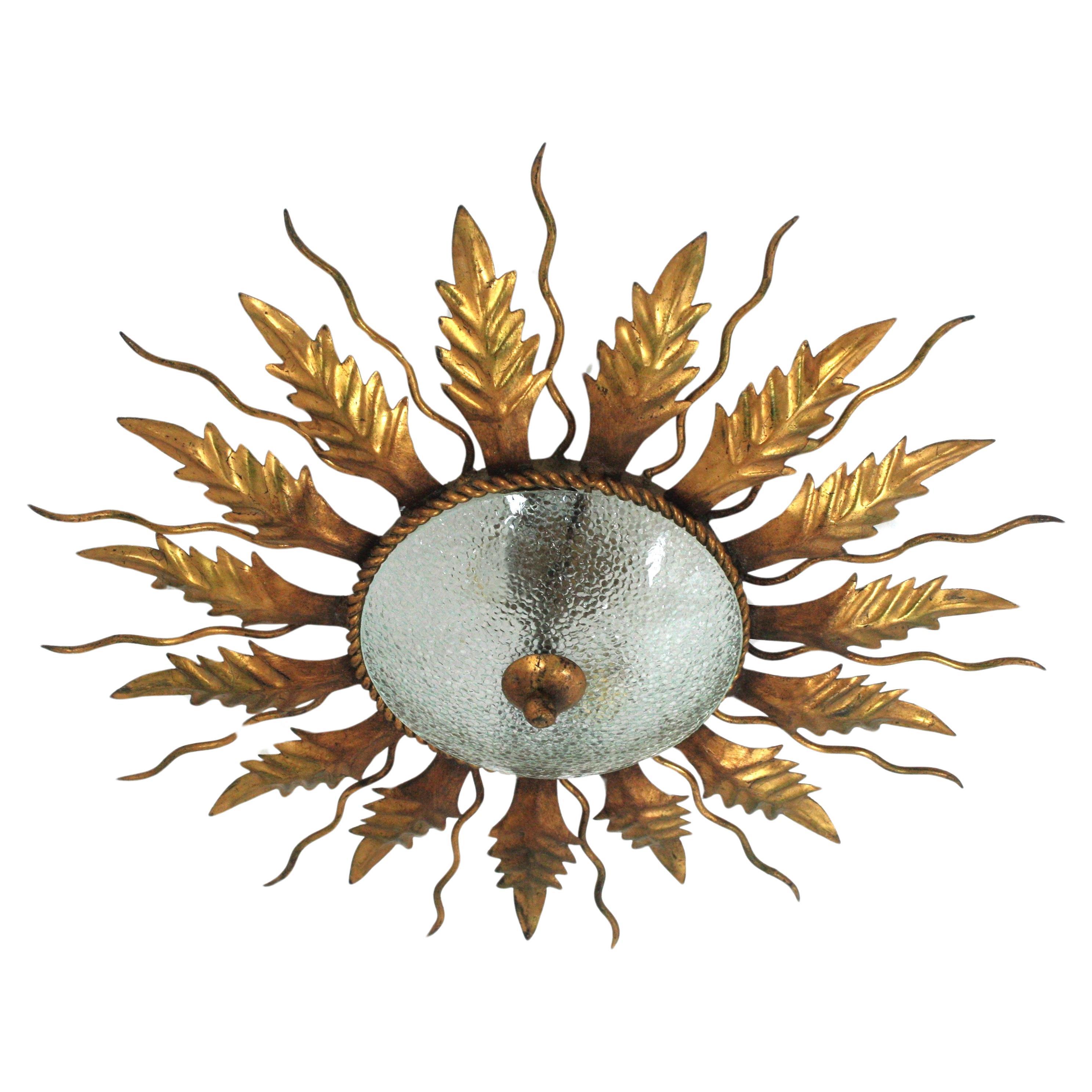 Sunburst Ceiling Light Fixture in Gilt Wrought Iron and Cracked Glass, 1950s For Sale