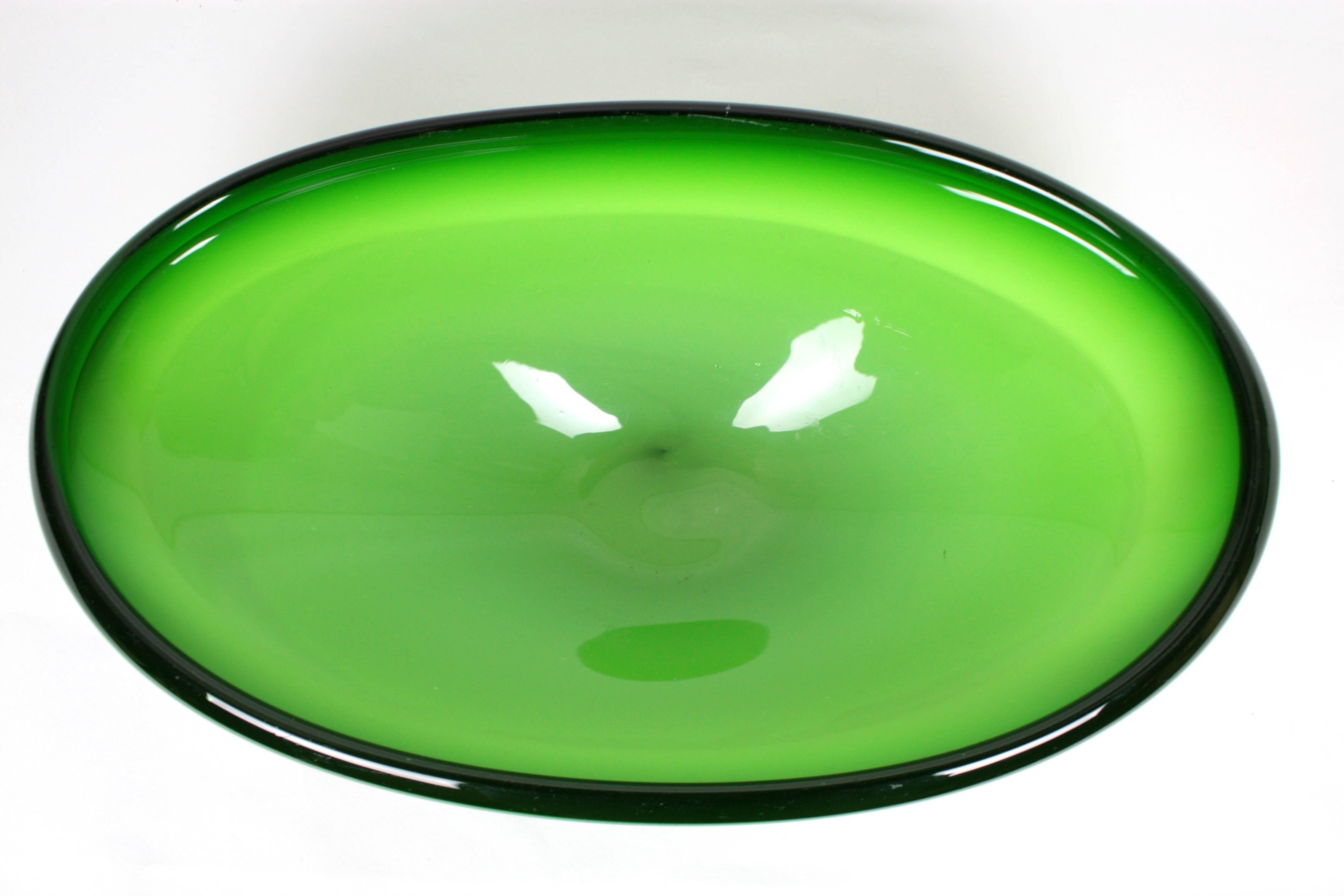 Huge and very decorative Murano handblown art glass centerpiece bowl. Green opaline glass cased into green clear glass. Useful as decorative bowl, candy bowl or fruit bowl, Italy, 1960s.

More Murano glass bowls and centerpieces are avaliable in