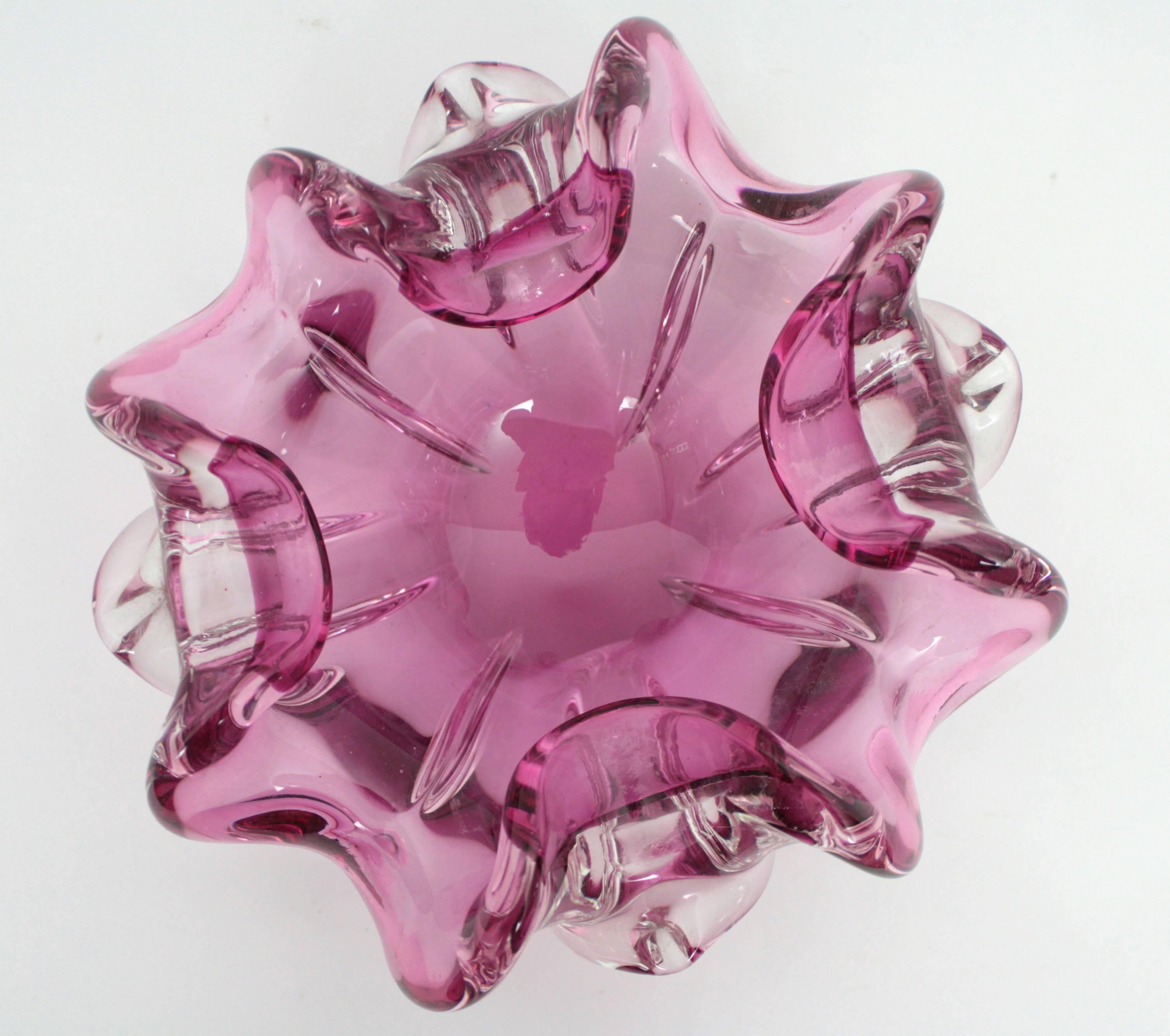 A highly decorative large flower shaped handblown Murano glass bowl. Pink glass cased into clear glass, sculptural organical open flower form with a very nice color!
Useful as candy bowl, ashtray, videpoche or jewelry bowl. 

Italy,