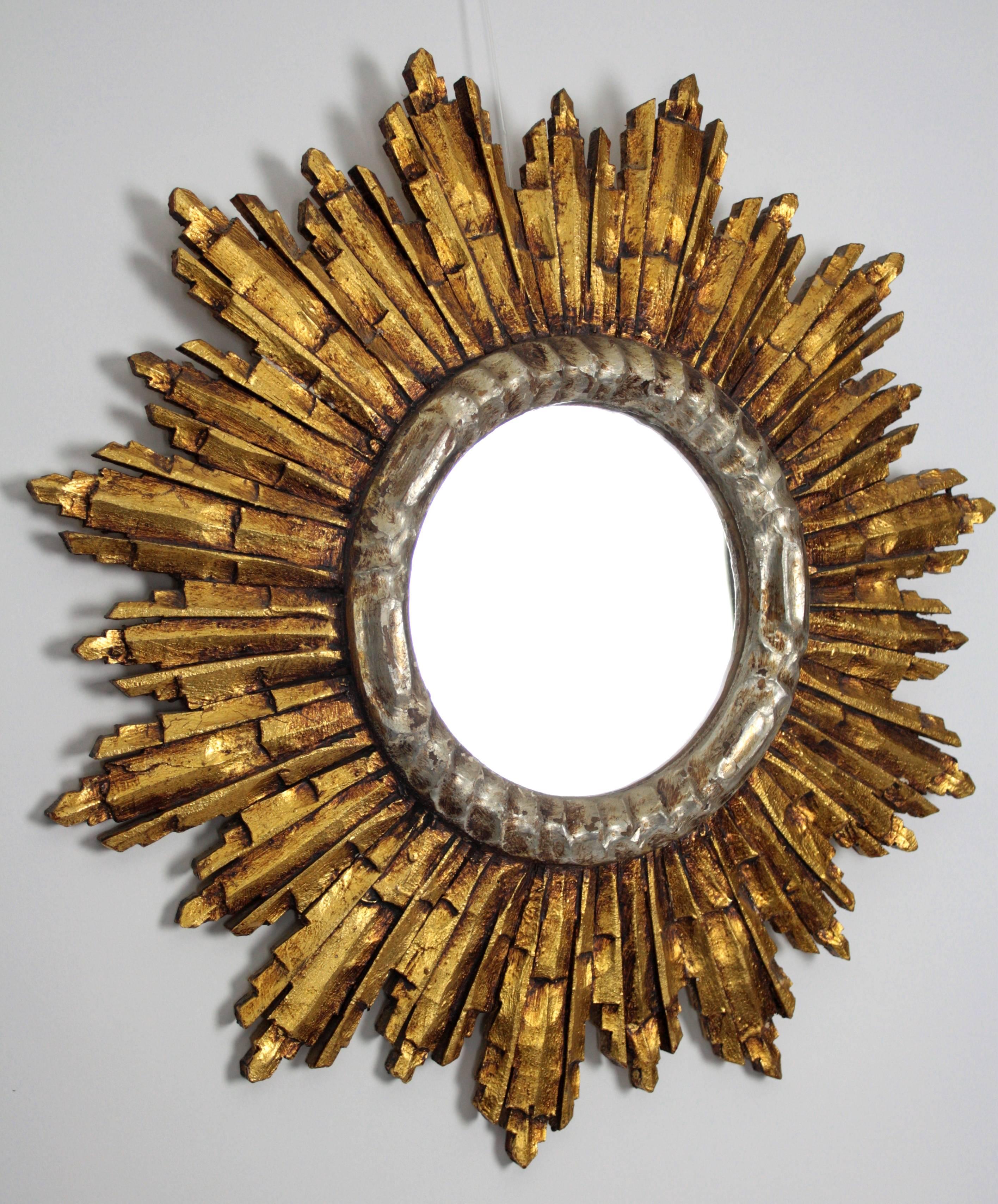 Gorgeous wood carved mirror in Baroque Style with silver leaf finish surrounding the glass and gold leaf finish in its beams. Very beautiful original patina. 
This piece is in excellent vintage condition
France, circa 1940s.

Available other