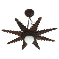 Spanish Colonial Starburst Pendant Light Fixture in Carved Wood, 1940s