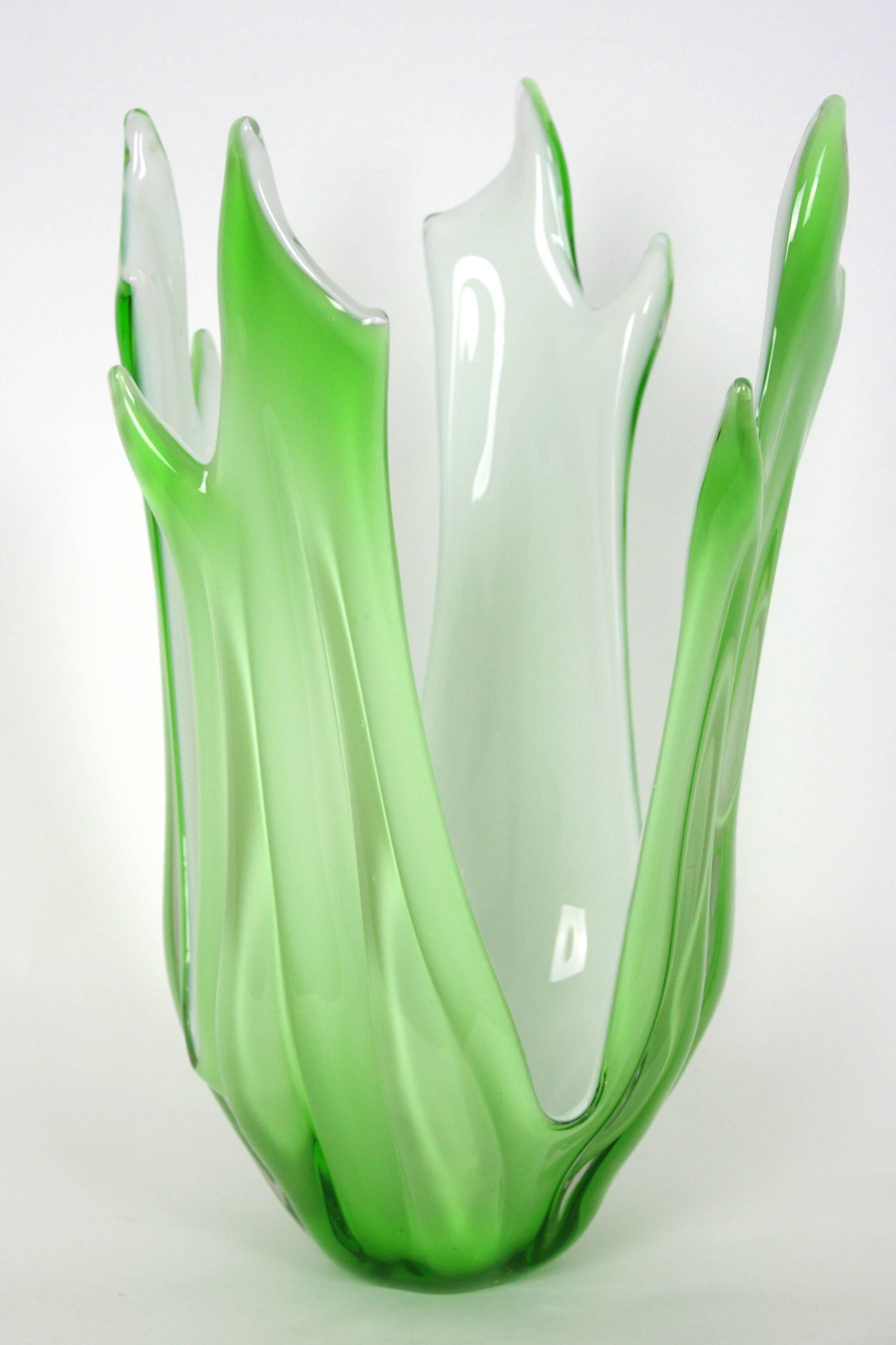 Sculptural and highly decorative large Murano glass vase in mint green color. The interior part is made in white opaline glass.
Excellent condition.
Italy, 1960s.

Avaliable other Murano glass pieces:
Please, kindly check our storefront.