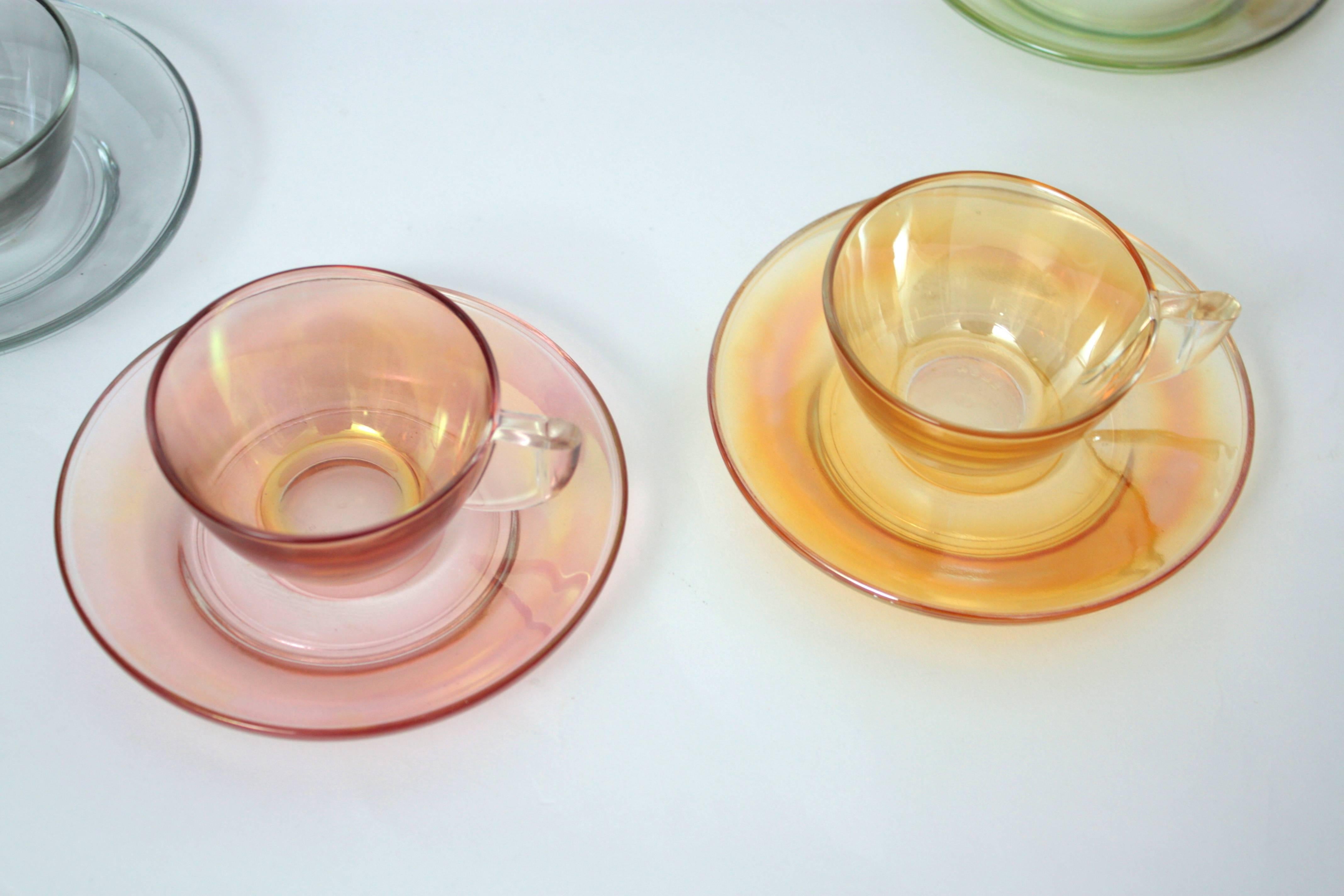A highly decorative set of six glass coffee cups and dishes. Each one in a different color, they have a very atrractive iridescent effect.
Spain, 1970.