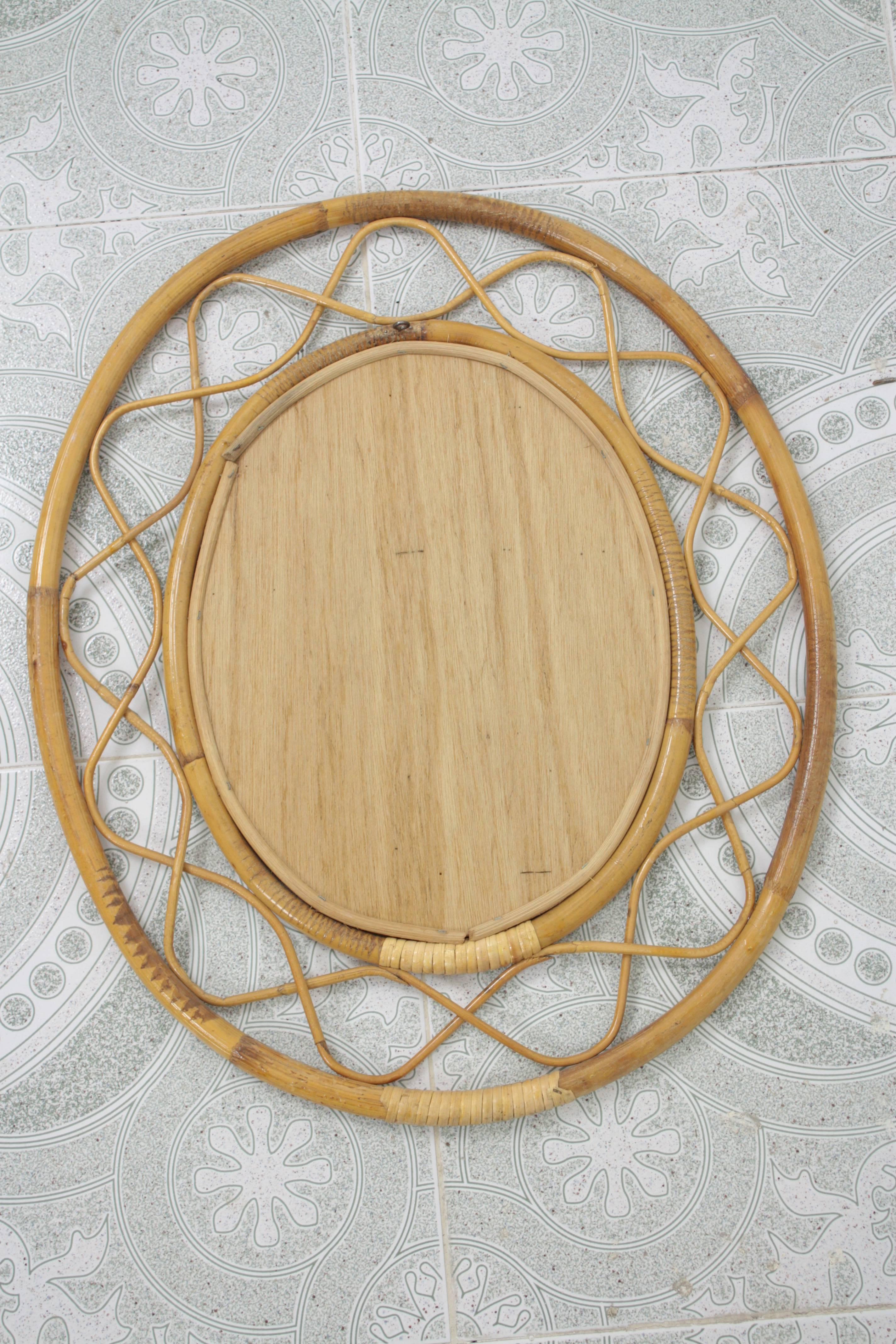 Mid-20th Century Jean Royère Style French Riviera Bamboo and Rattan Oval Mirror
