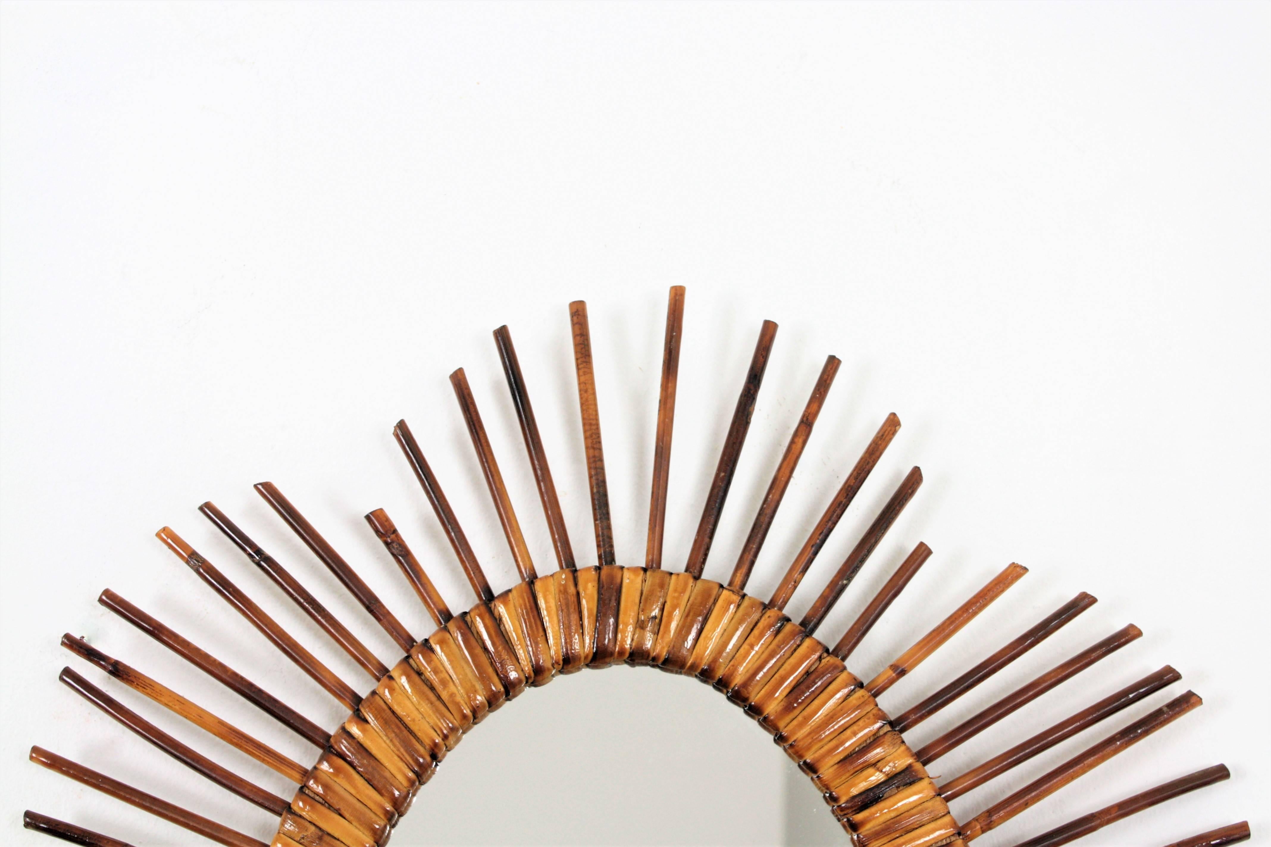 French Riviera Mid-20th Century Rattan Starburst Oval Mirrors In Excellent Condition In Barcelona, ES