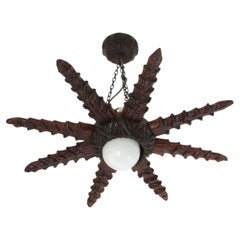 Spanish Colonial Starburst Pendant Light Fixture in Carved Wood, 1940s