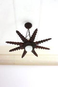 Spanish Colonial Starburst Pendant Light Fixture in Carved Wood, 1940s