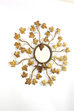 1950s Foliage Sunburst Mirror in Gilt Iron with Dragonfly and Grapes Motif
