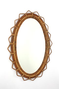 Midcentury Rattan Oval Mirror with Jagged Edge, French Riviera, 1950s