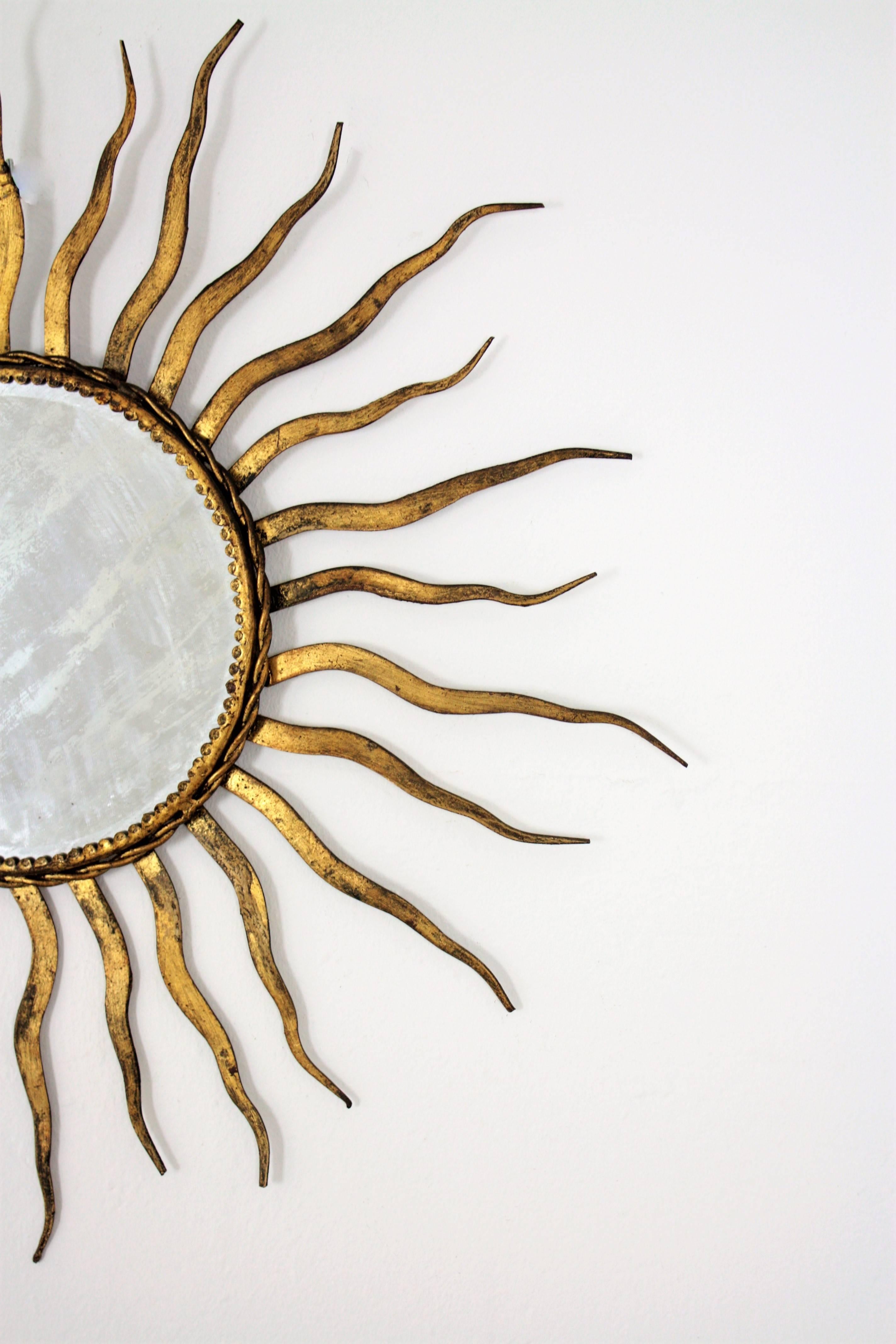 Mid-Century Modern French 1950s Wrought Gilt Iron Sunburst Mirror in the Style of Gilbert Poillerat