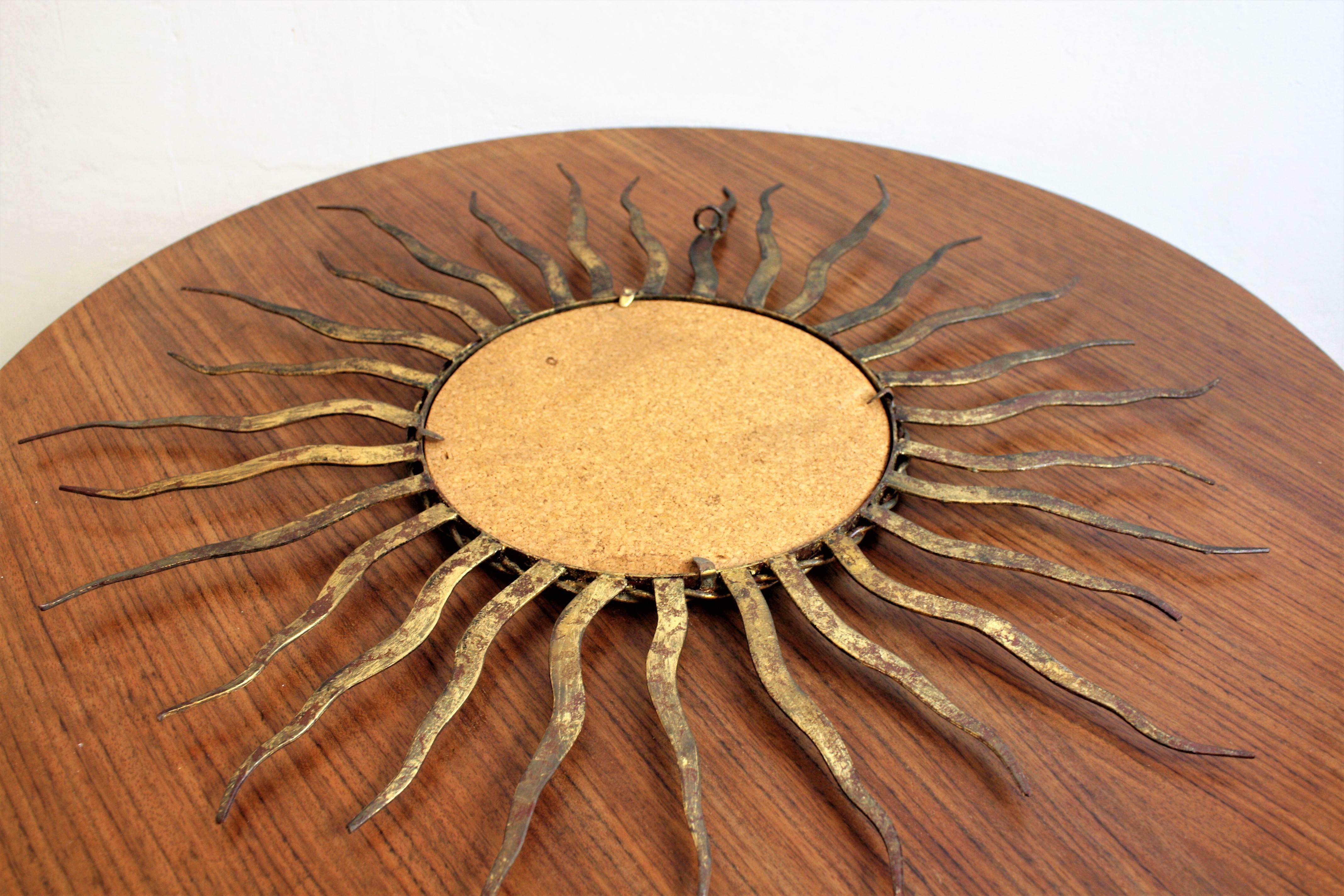 French 1950s Wrought Gilt Iron Sunburst Mirror in the Style of Gilbert Poillerat 1