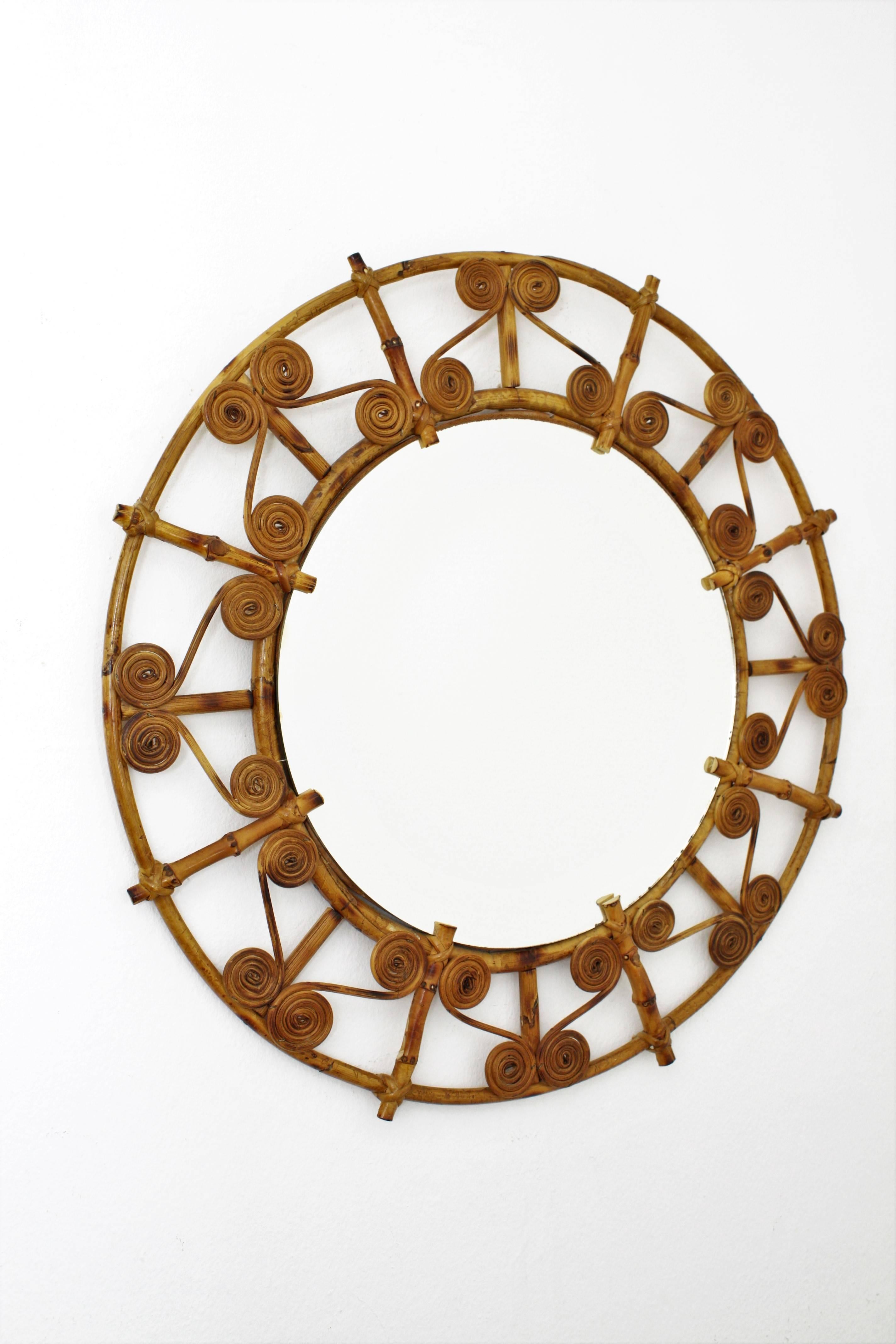Lovely handcrafted bamboo and rattan mirror with a decorative frame with filigree details.
Beautiful to place alone or in a wall decoration with other mirrors in this manner,
Spain, 1950s.


Avaliable a huge collection of cane mirrors and other