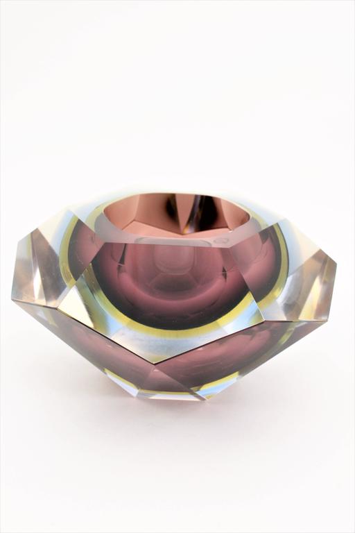 A monumental Sommerso faceted Murano glass bowl or centerpiece. Garnet, yellow and blue triple cased glass in clear class, faceted diamond shape and an unusual extra large size. This is the bigger size in this design we have ever seen. Attributed to
