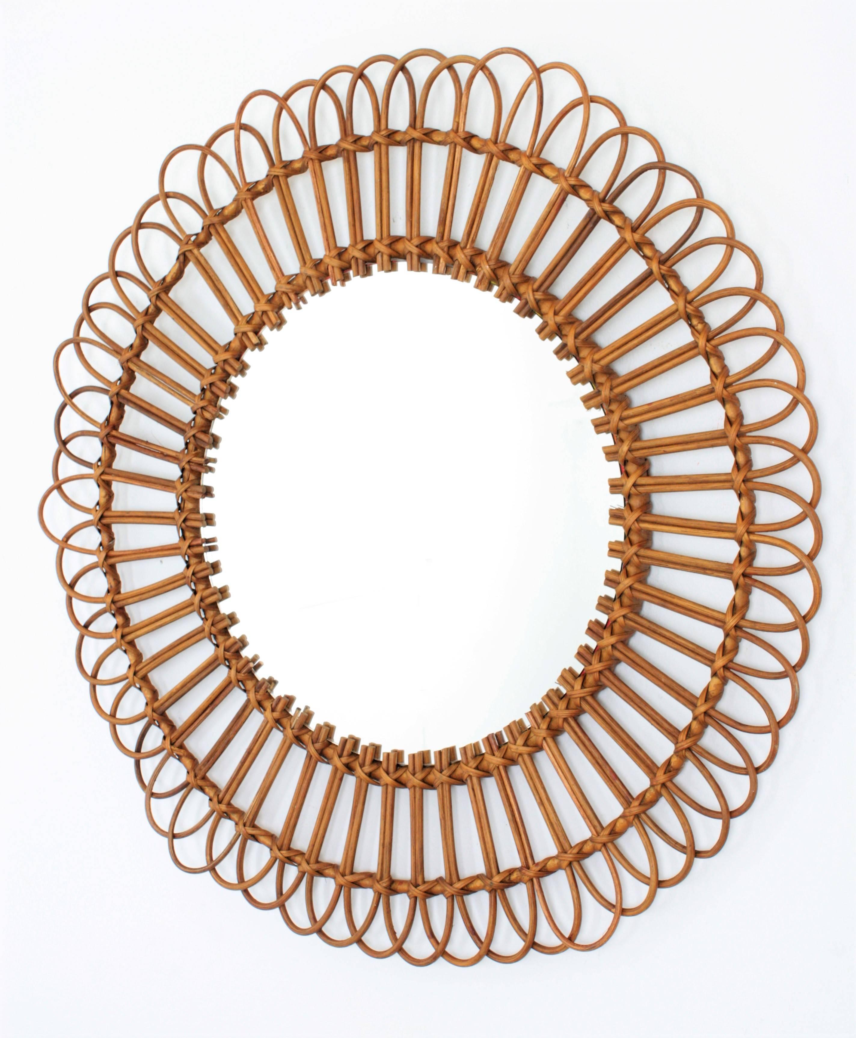 A flower burst or sunburst circular mirror handcrafted with natural rattan cane and wicker. 
A natural and fresh accent for a decoration, with all the taste of the Mediterranean Coast. This kind of mirrors were typical from the Spanish