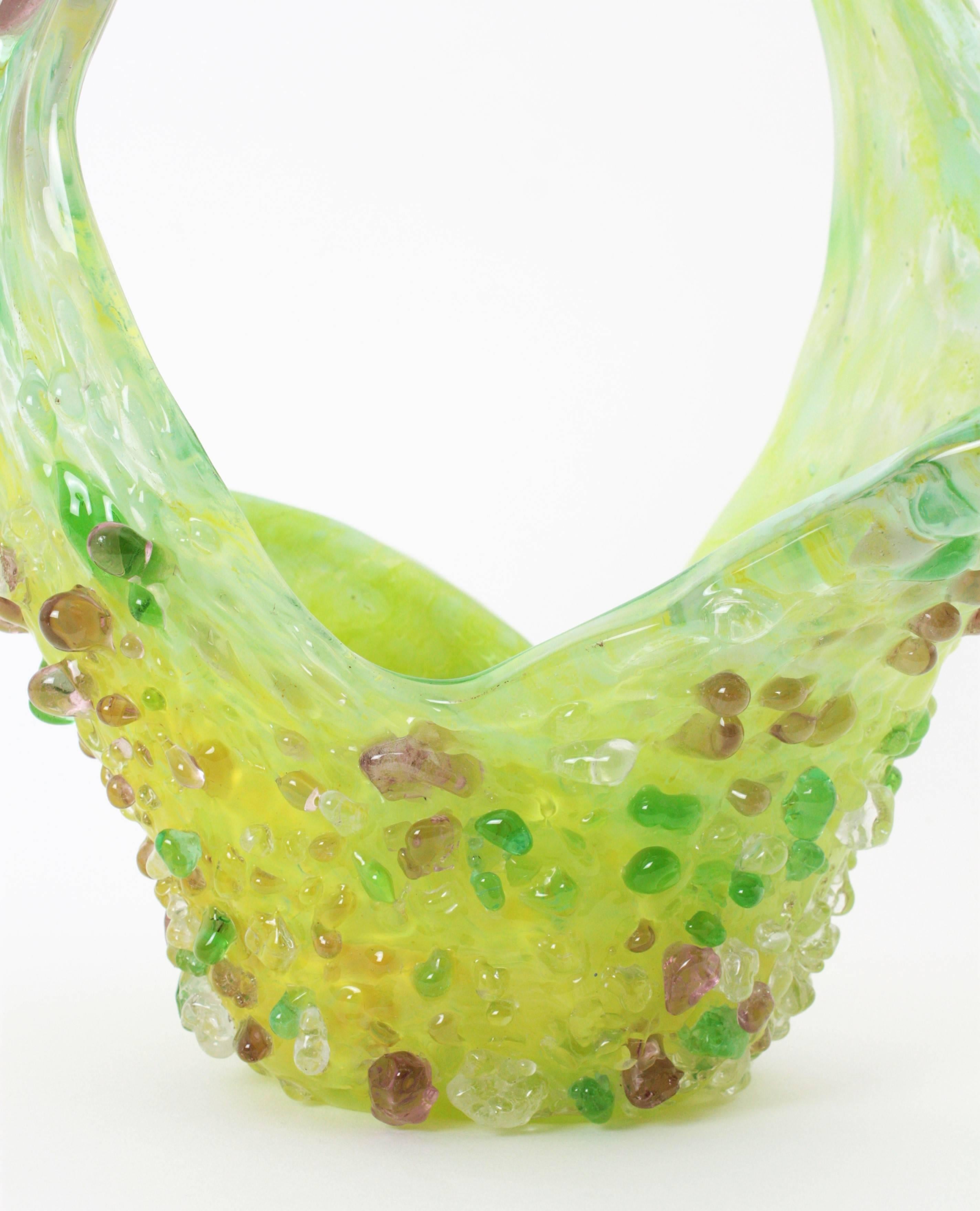 An unique and exceptional Murano art glass piece in fresh lime green, mint green and yellow colors with basket shape. This vase has a colorful external decoration with mauve, green, yellow and clear applied glass drops. 
Italy, 1950s.

Avaliable