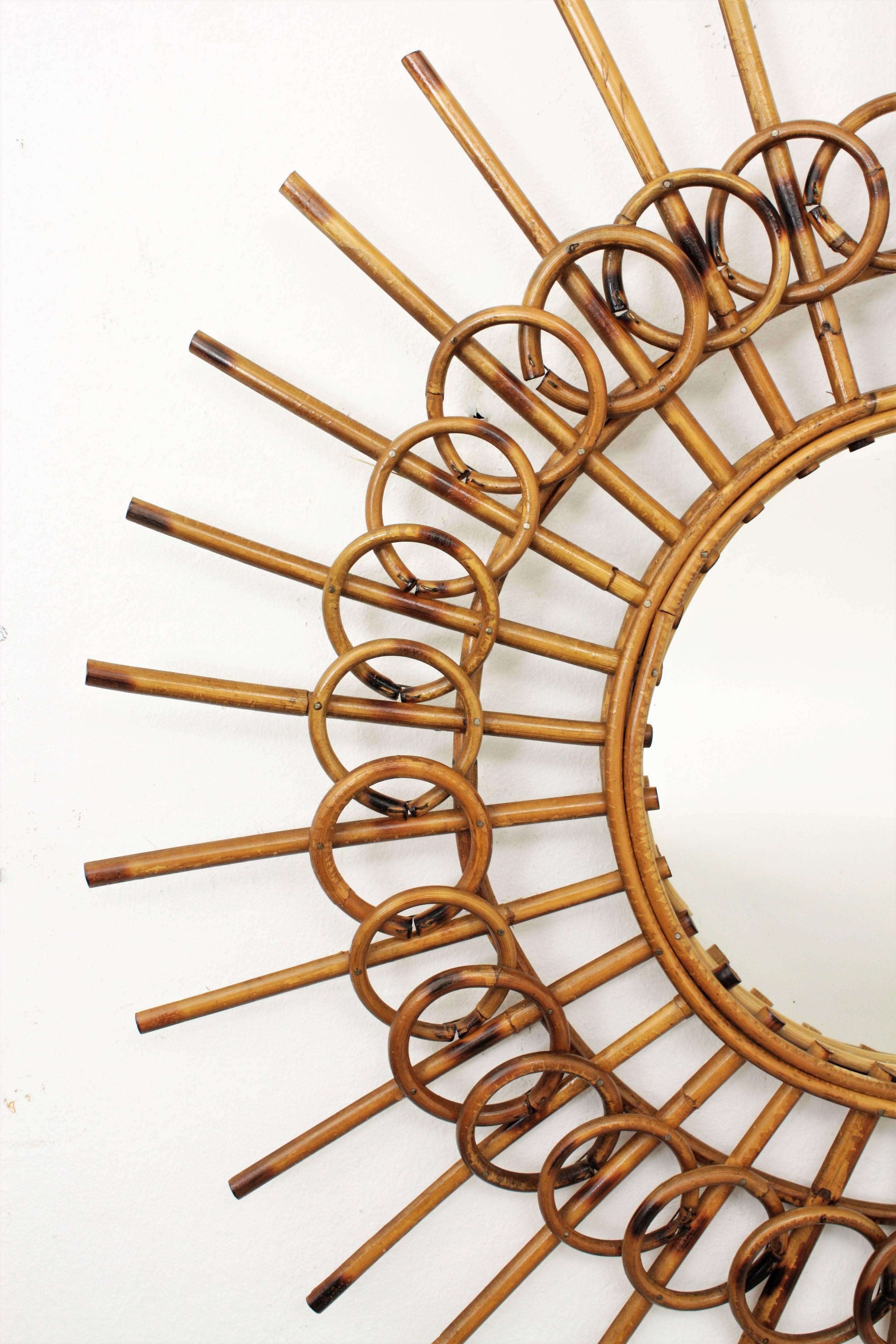 Hand-Crafted 1960s French Riviera Mid-Century Modern Rattan Sunburst Mirror Framed by Circles