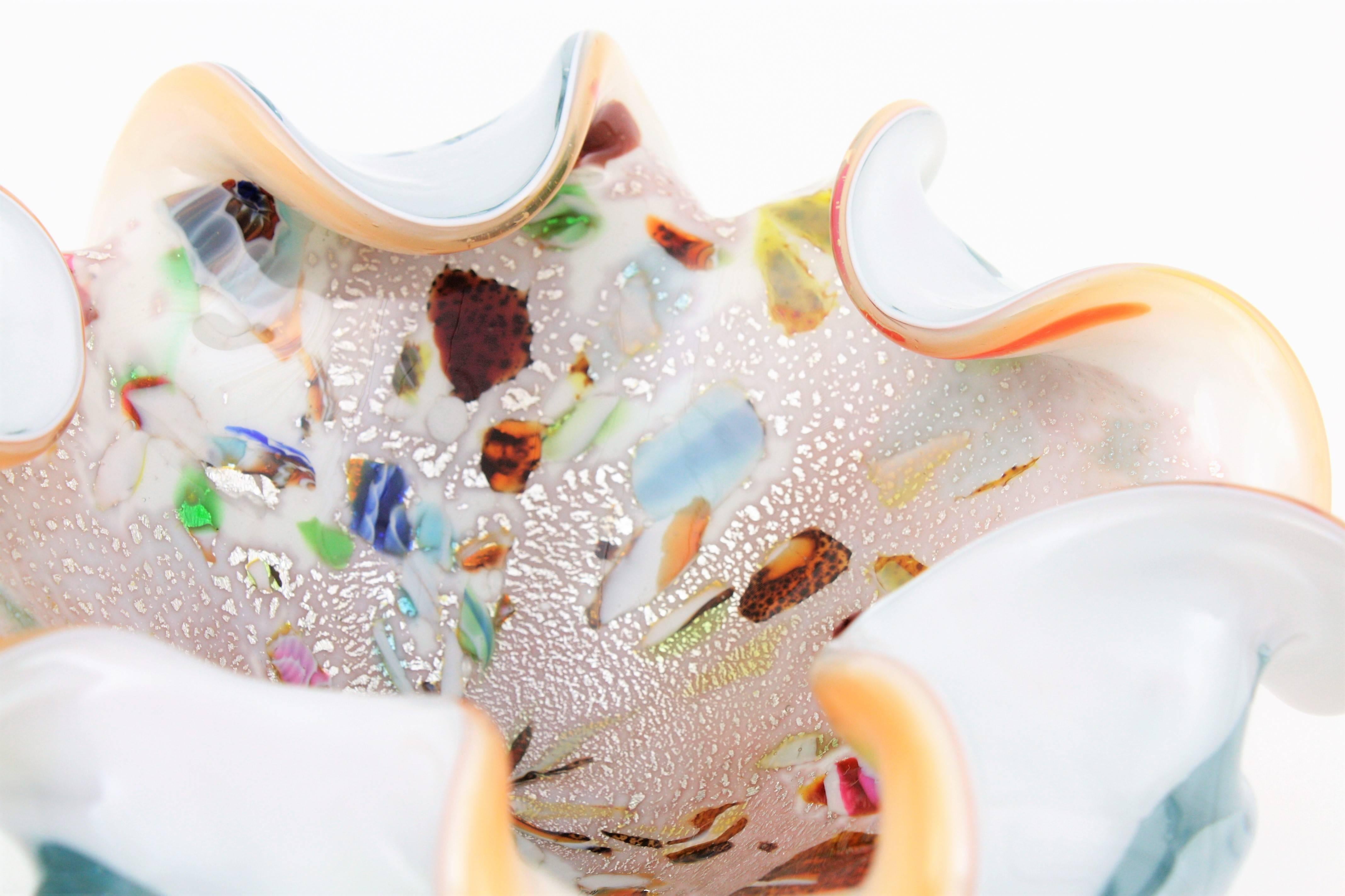 Sculptural and colorful Tutti Frutti Murano art glass bowl attributed to Dino Martens and Arte Vetreria Muranese. Zanfirico and latticino techniques in pastel colors and silver aventurine flecks inclussions.
The bowl has a whimsically beautiful