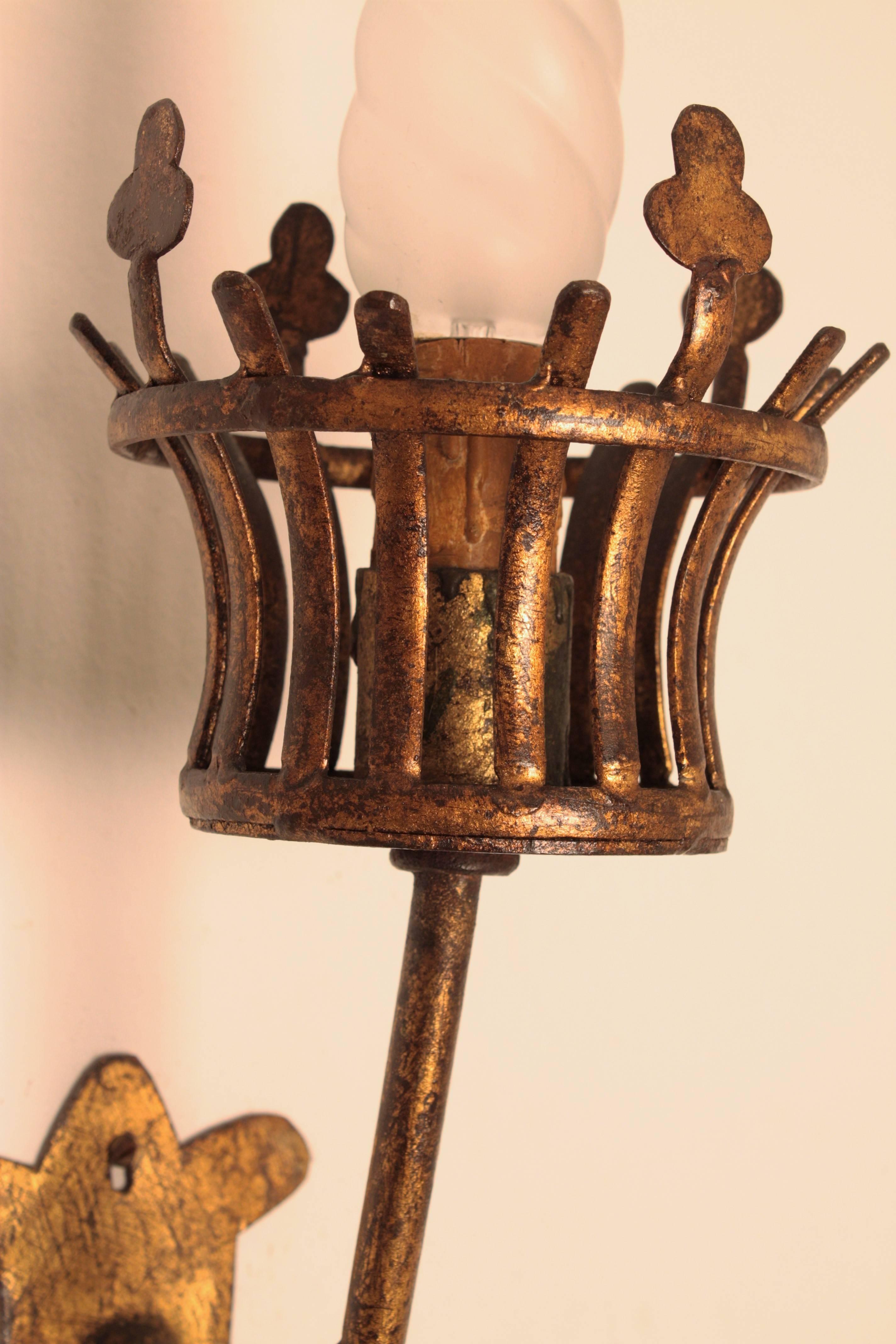 Pair of French Medieval Style Hand-Hammered Gilt Iron Torch Sconces In Excellent Condition In Barcelona, ES